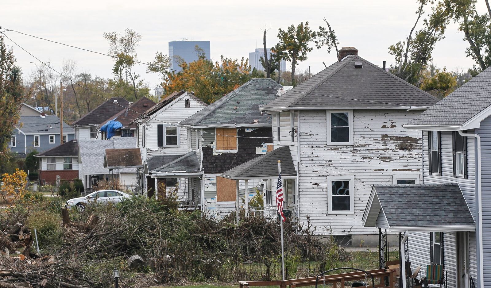 Many houses along Rolfe Avenue in Harrison Twp. continue to bear the scars of the EF4 tornado more than five months after the storm. CHRIS STEWART / STAFF