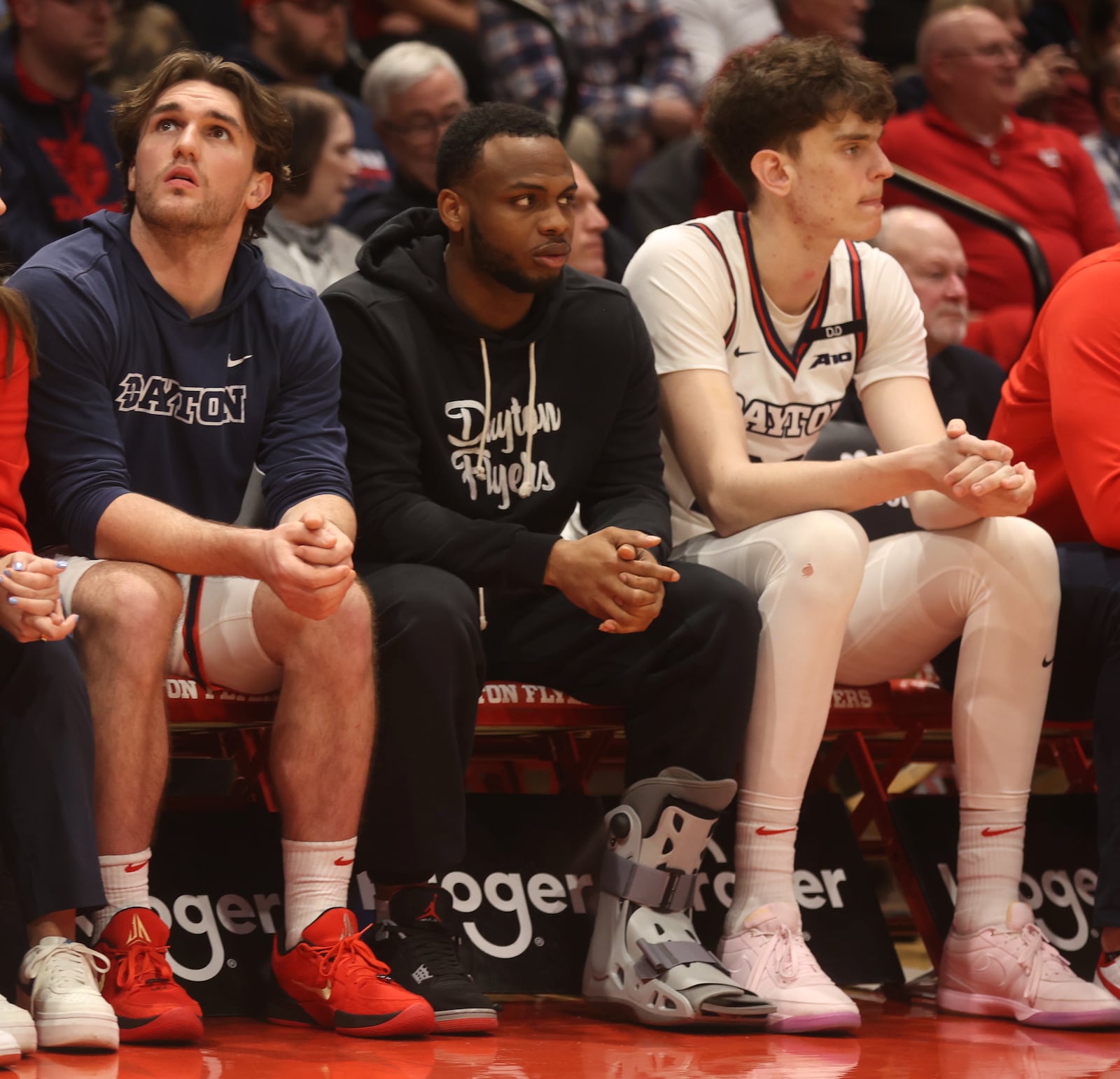 Dayton's Posh Alexander, center, watches the action during a game against George Mason in the second half on Wednesday, Jan. 15, 2025, at UD Arena. David Jablonski/Staff