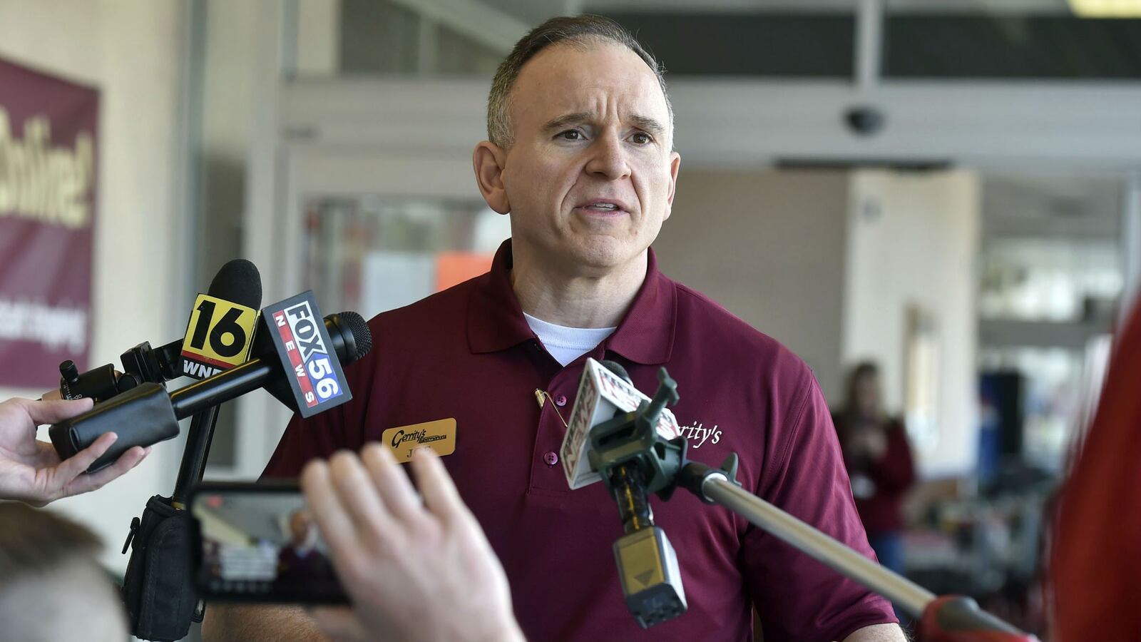 Gerrity's supermarket co-owner Joe Fasula talks to reporters about having to throw out $35,000 worth of produce and other groceries after a woman entered the store Wednesday, March 25, 2020, and coughed and spit on the items. Margaret Ann Cirko, 35, of Hanover Township, Pa., is charged with four felonies, including making terroristic threats, in the incident.