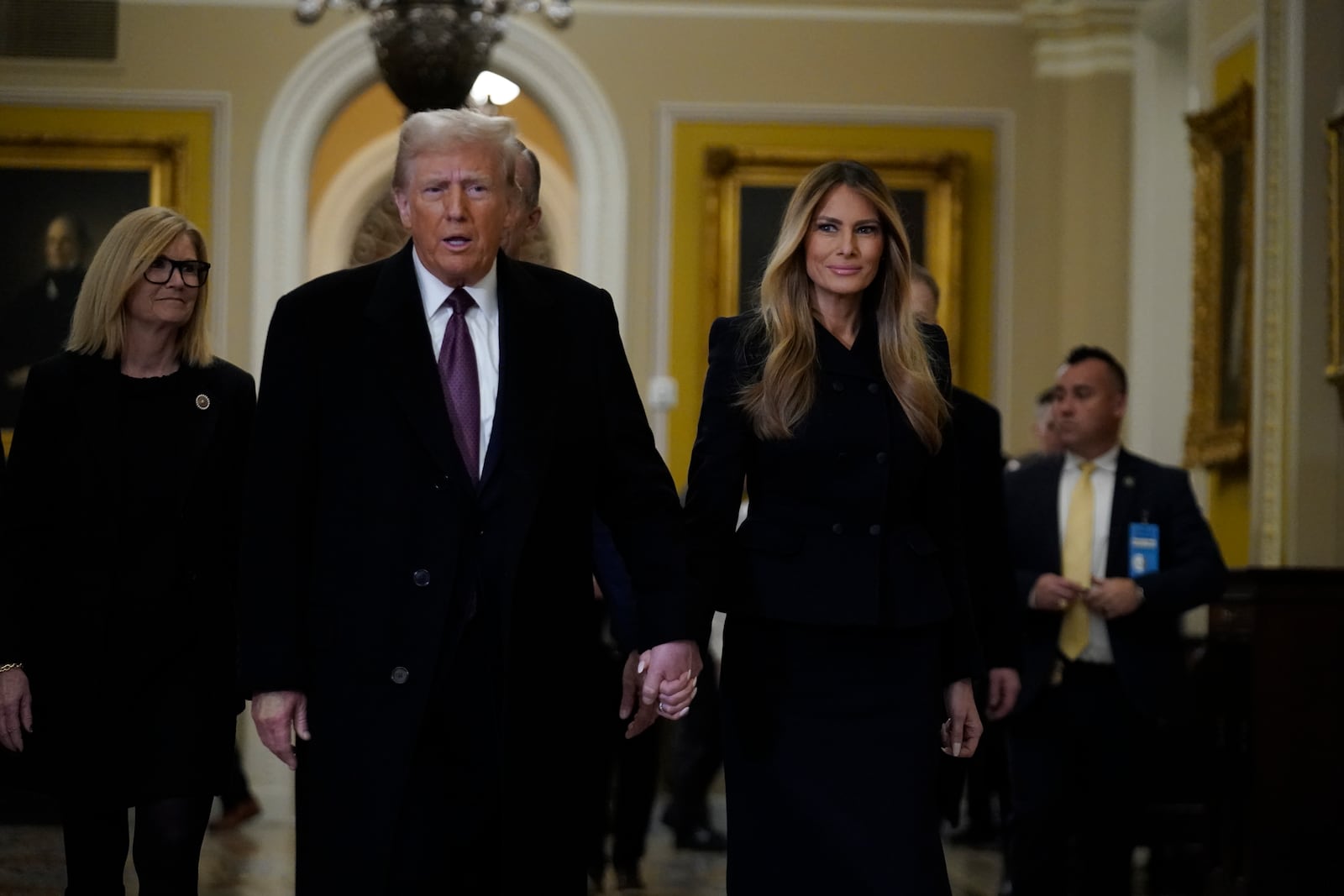 President-elect Donald Trump walks with Melania Trump at the Capitol Wednesday, Jan. 8, 2025, in Washington. (AP Photo/Jose Luis Magana)