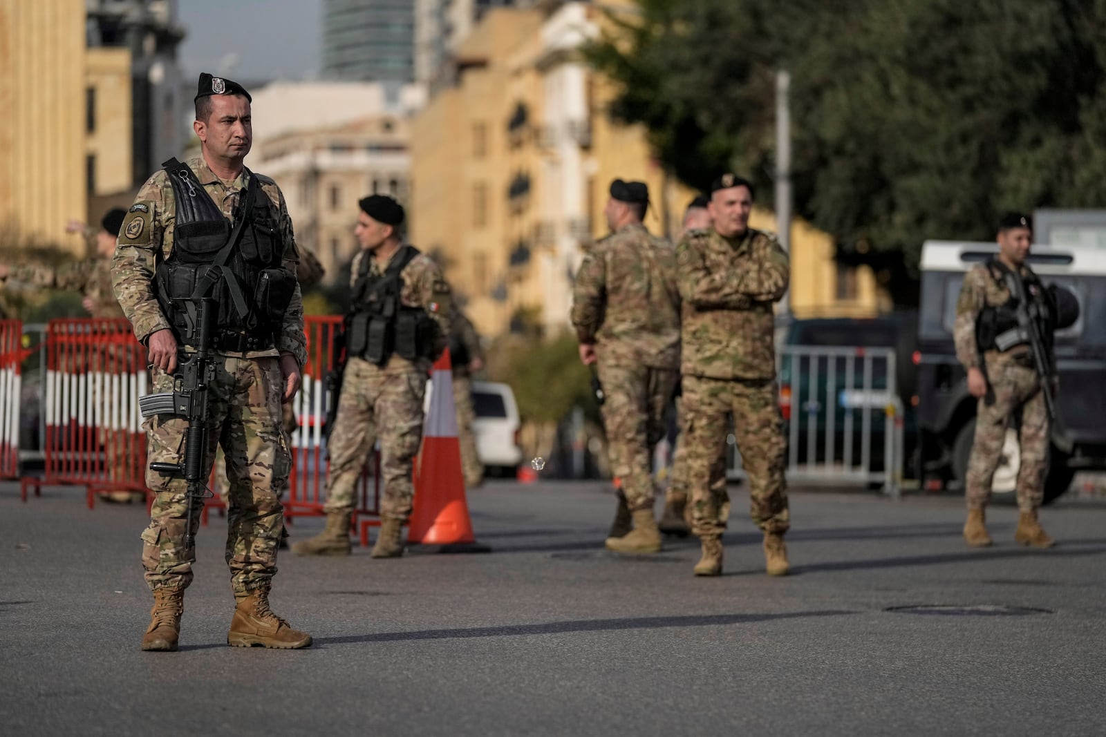 Lebanese army soldiers block a road that leads to the parliament building while lawmakers gather to elect a president in Beirut, Lebanon, Thursday, Jan. 9, 2025. (AP Photo/Bilal Hussein)