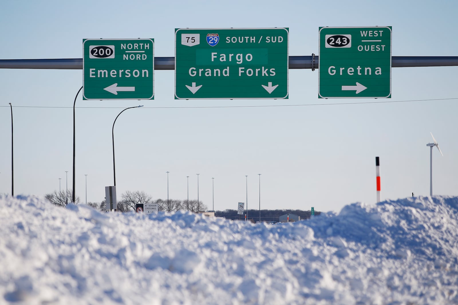 FILE - Road signage is posted just outside of Emerson, Manitoba, Jan. 20, 2022. (John Woods/The Canadian Press via AP, File)