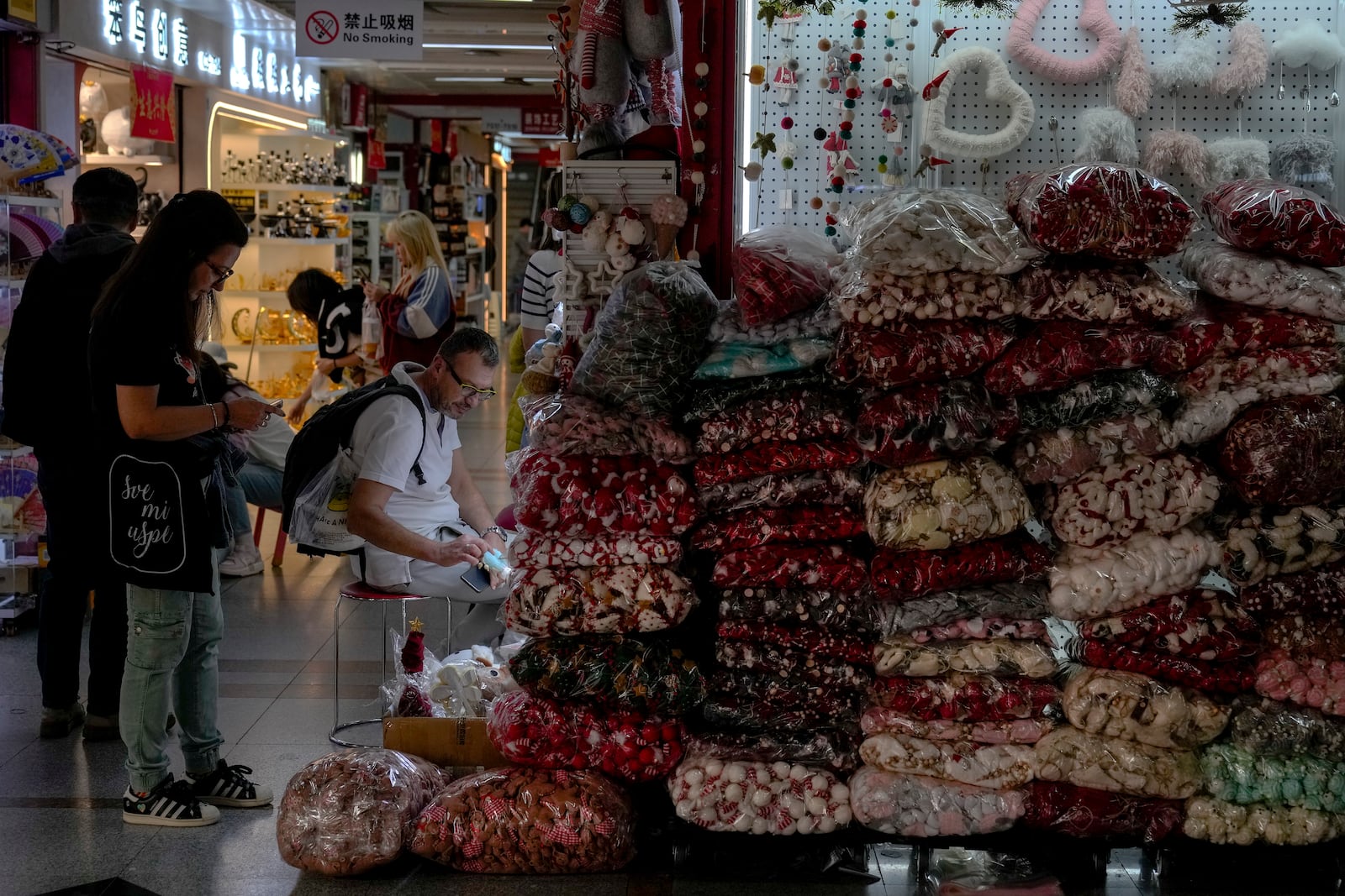 Foreign buyers shop for Christmas season decorations at the Yiwu wholesale market in Yiwu, east China's Zhejiang province on Nov. 8, 2024. (AP Photo/Andy Wong)