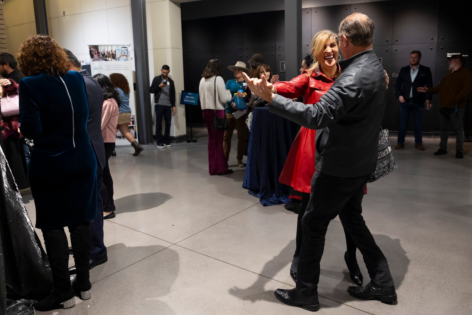 Dr. Annette Goldberg dances with Sheldon Weisfeld during a Chicanukah mariachi performance at Holocaust Museum Houston on Thursday, December 19, 2024, in Houston. (AP Photo/Annie Mulligan)