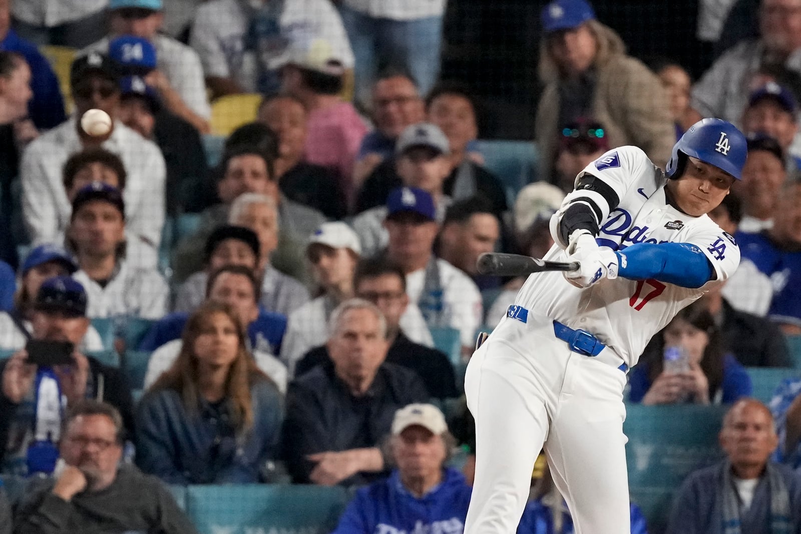 Los Angeles Dodgers' Shohei Ohtani connects for a double during the eighth inning in Game 1 of the baseball World Series against the New York Yankees, Friday, Oct. 25, 2024, in Los Angeles. (AP Photo/Mark J. Terrill)