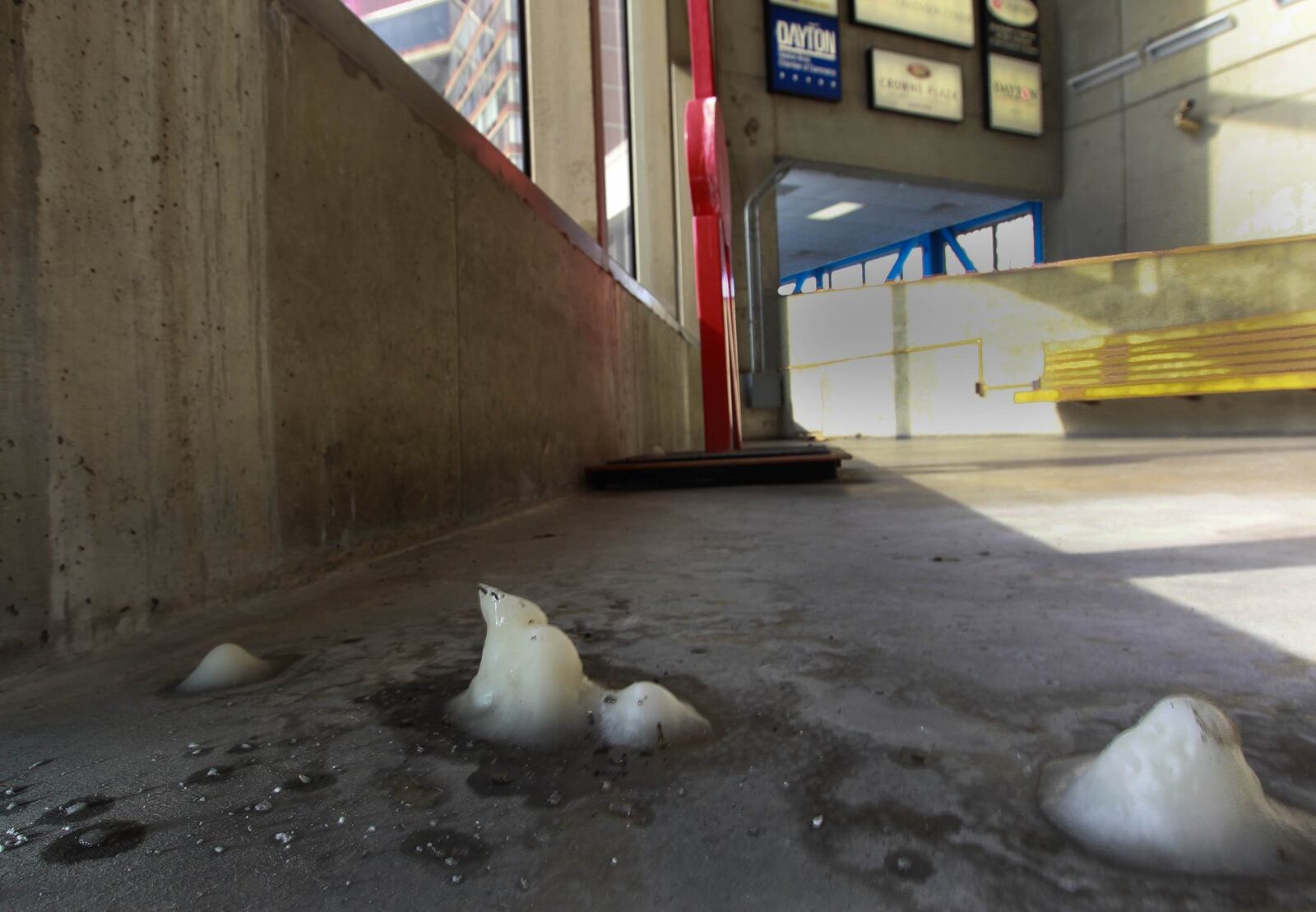 The 42-year-old Dayton Convention Center is showing its age. Here, ice from a leak has formed near the parking garage elevators in the walkway leading to the center.. JIM WITMER / STAFF