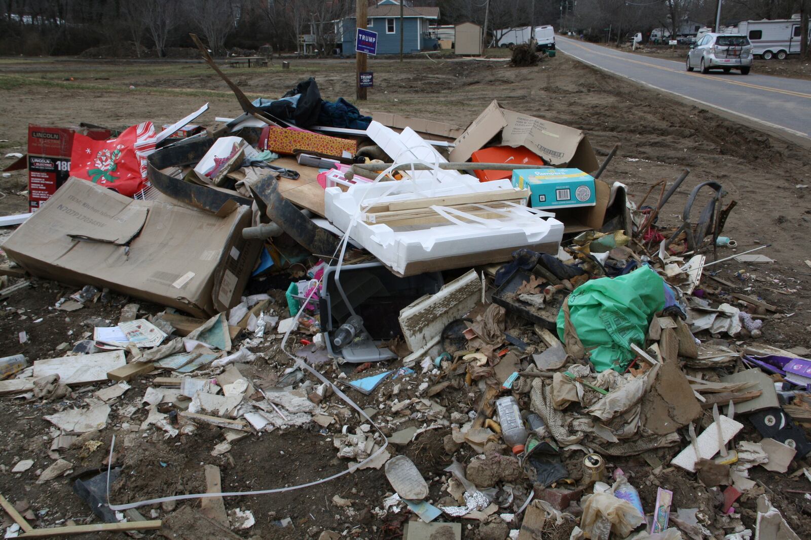 Garbage and debris sitin a heap in front of Emily Russell's home in Swannanoa, N.C., on Thursday, Feb. 6, 2025. (AP Photo/Makiya Seminera)