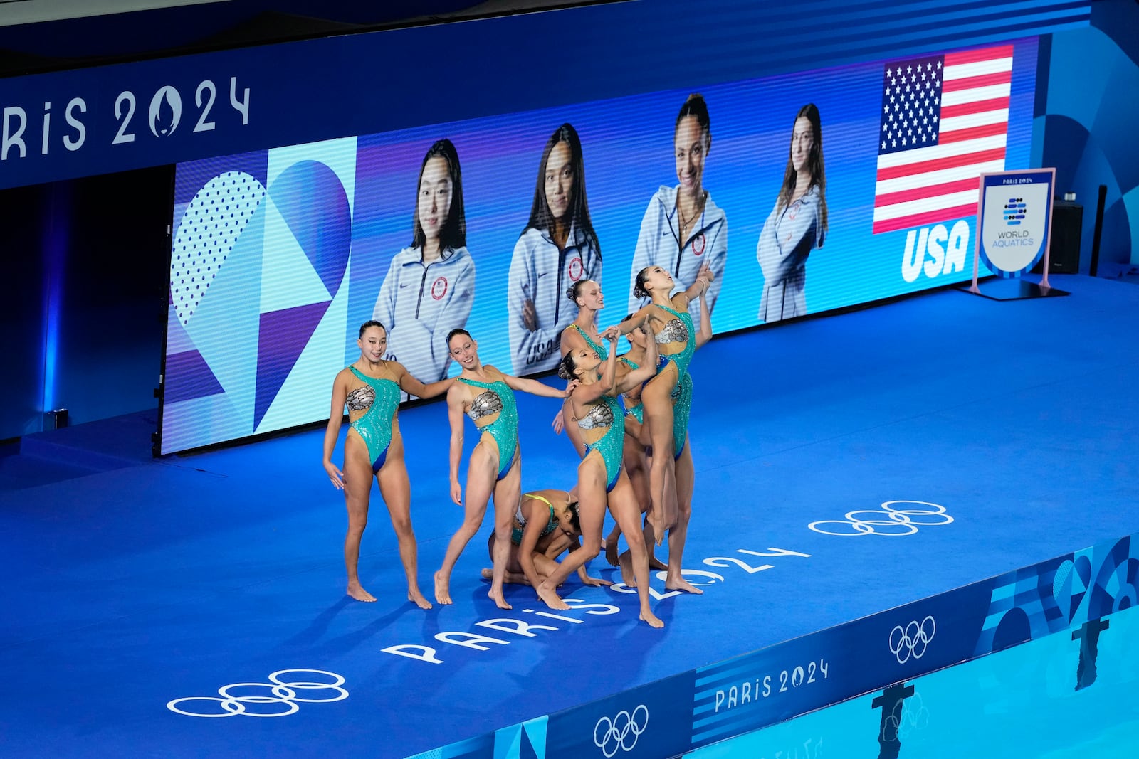 FILE - Team USA compete in the team free routine of artistic swimming at the 2024 Summer Olympics, Aug. 6, 2024, in Saint-Denis, France. (AP Photo/Lee Jin-man, File)