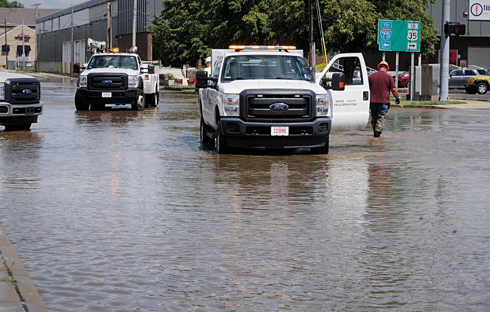 A water main break involving a 48-inch pipe at Keowee Street and Monument Avenue on Monday affected businesses in the area. MARSHALL GORBY/STAFF