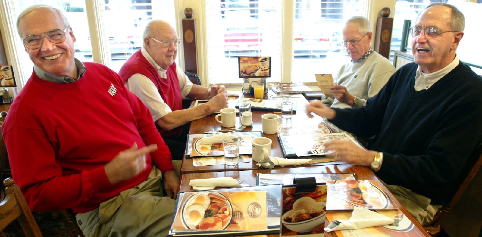 Former Flyers Jim Paxson Sr., Junior Norris, Don Donoher and Monk Meineke meet at Bob Evans in 2004. Bill Reinke/Staff