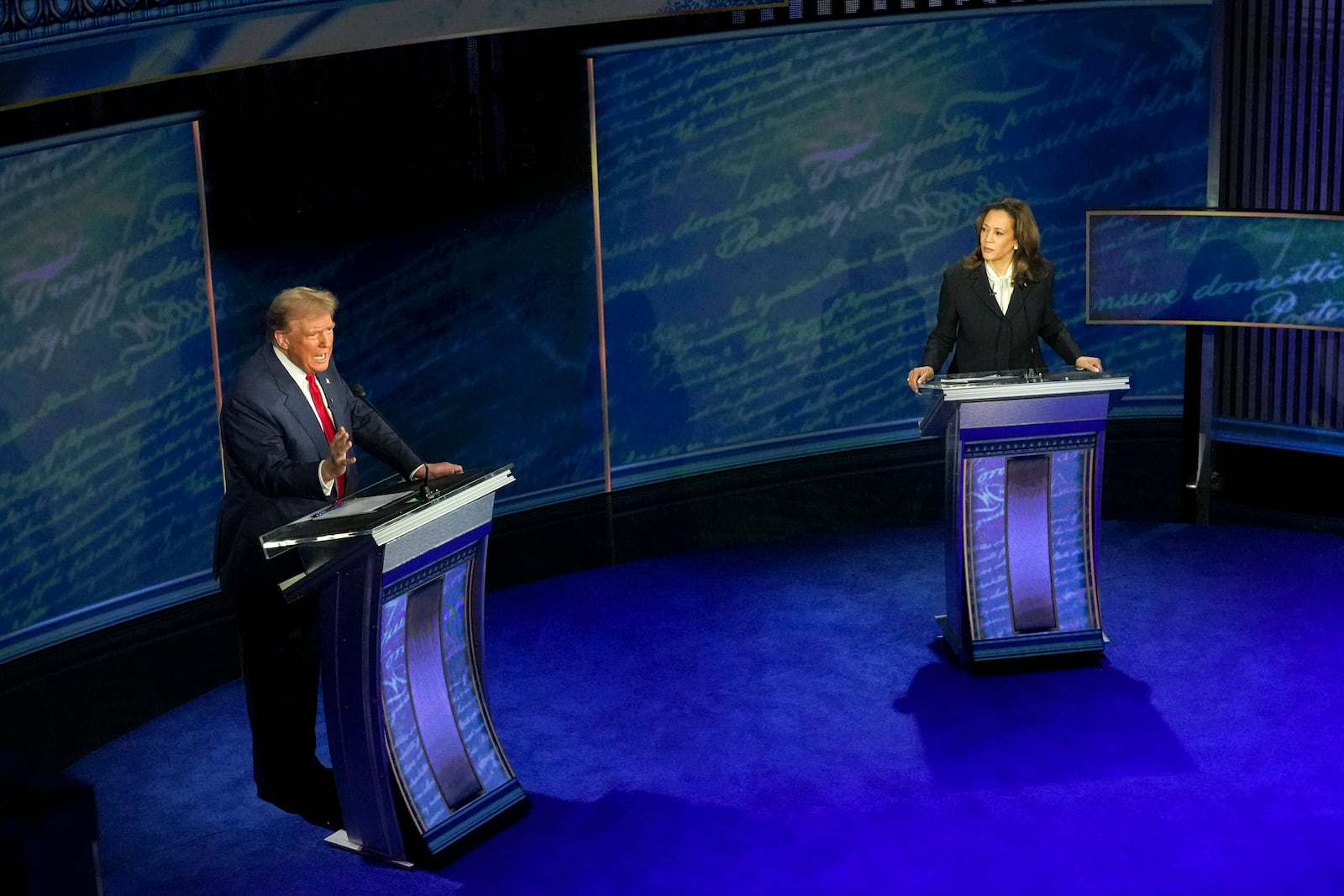 
                        Former President Donald Trump and Vice President Kamala Harris speak over each other during the presidential debate at the National Constitution Center in Philadelphia, on Tuesday, Sept. 10, 2024. During the debate, Trump used the phrase “execute the baby” to attack Harris for her support of abortion rights. (Doug Mills/The New York Times)
                      