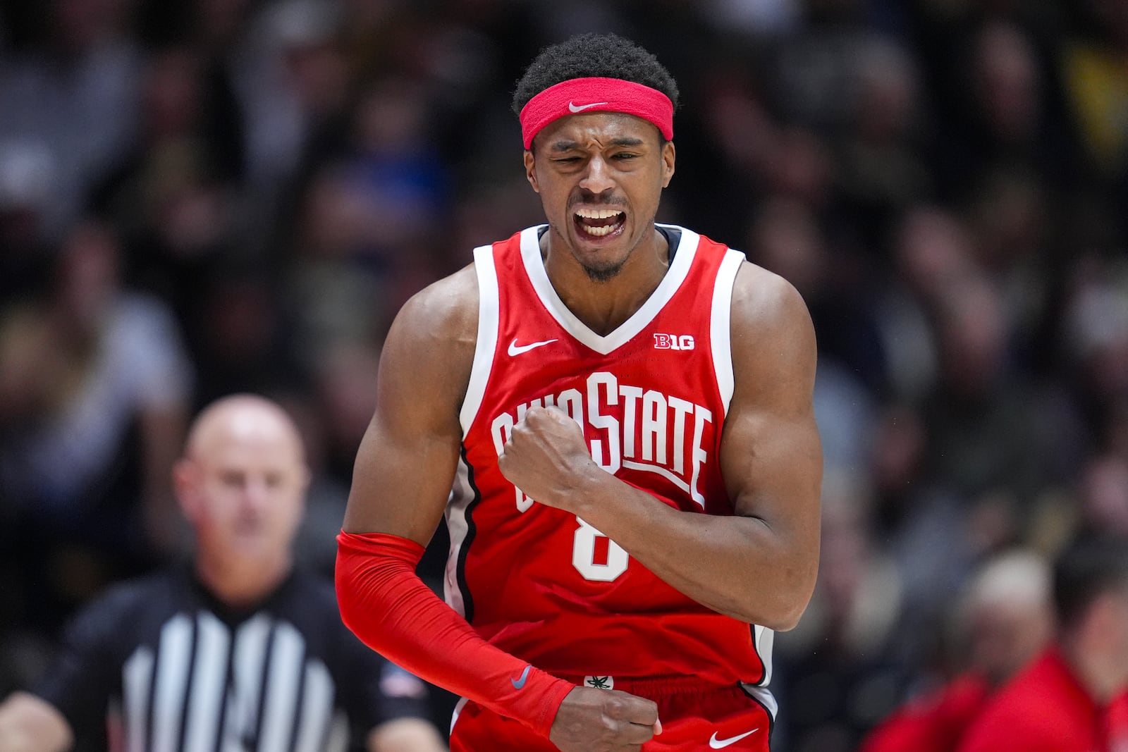 Ohio State guard Micah Parrish (8) celebrates after a three-point basket against Purdue during the second half of an NCAA college basketball game in West Lafayette, Ind., Tuesday, Jan. 21, 2025. (AP Photo/Michael Conroy)