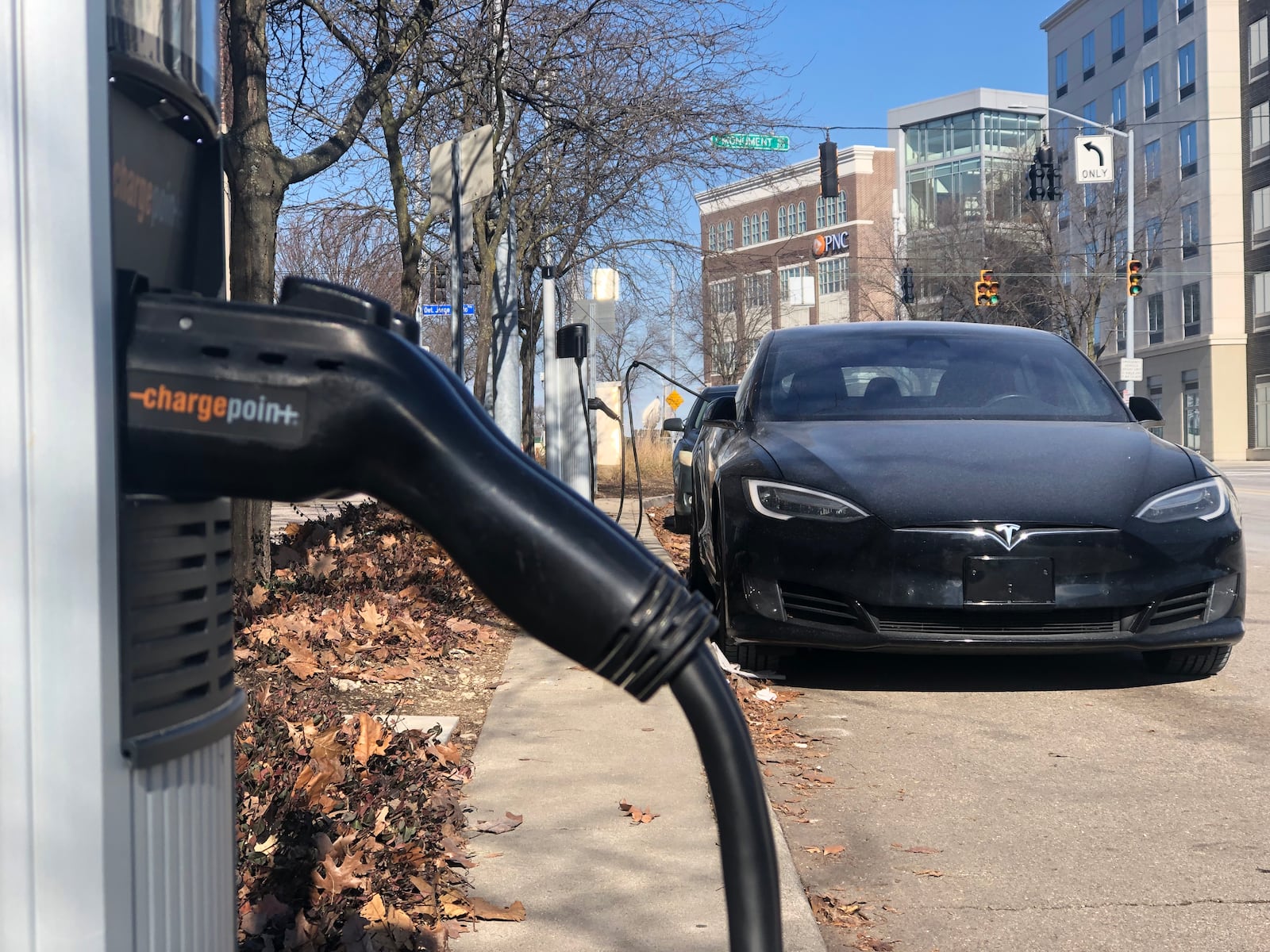 An electric vehicle charging station across from the Day Air Ballpark, where the Dayton Dragons play, in downtown Dayton. CORNELIUS FROLIK / STAFF