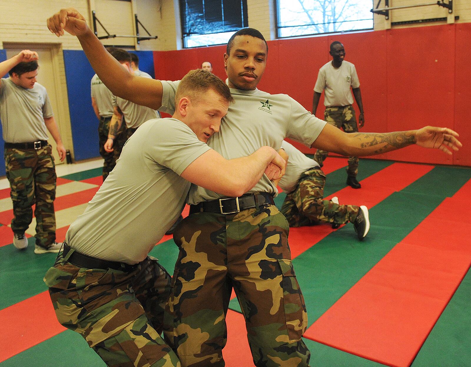 Police cadet Brent Douglas takes down cadet Domon Cunningham during subject control techniques training, Tuesday, Feb. 6, 2024. MARSHALL GORBY\STAFF