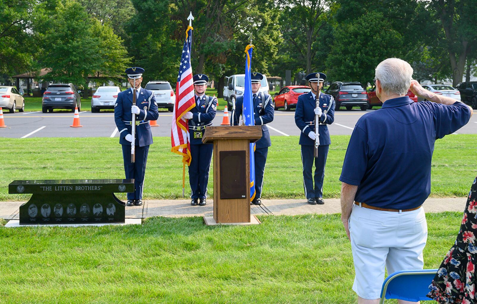 Jerry Litten salutes the flag at the end of a ceremony July 20 dedicating a memorial bench honoring him and his brothers at the National Museum of the U.S. Air Force. U.S. AIR FORCE PHOTO/R.J. ORIEZ