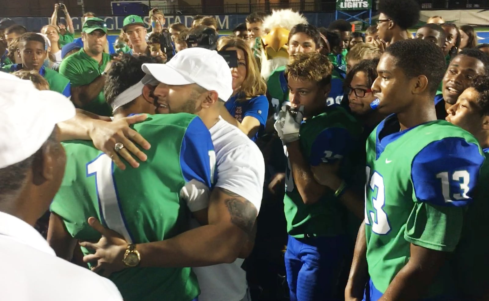 CJ quarterback Ryan Minor (left) celebrated a 58-16 Week 3 defeat of visiting Greenville with a surprise visit from his father, Chris Minor, a captain who’s deployed at Turkey with the U.S. Air Force. MARC PENDLETON / STAFF