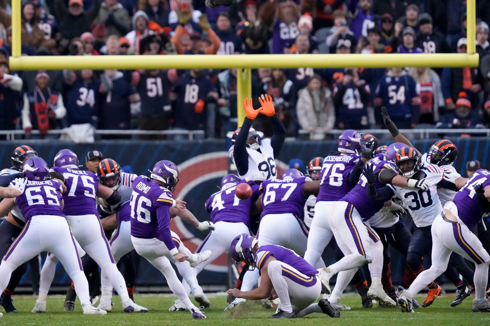 Minnesota Vikings place kicker Parker Romo (96) makes the game-wining field goal in overtime of an NFL football game against the Chicago Bears, Sunday, Nov. 24, 2024, in Chicago. (AP Photo/Charles Rex Arbogast)