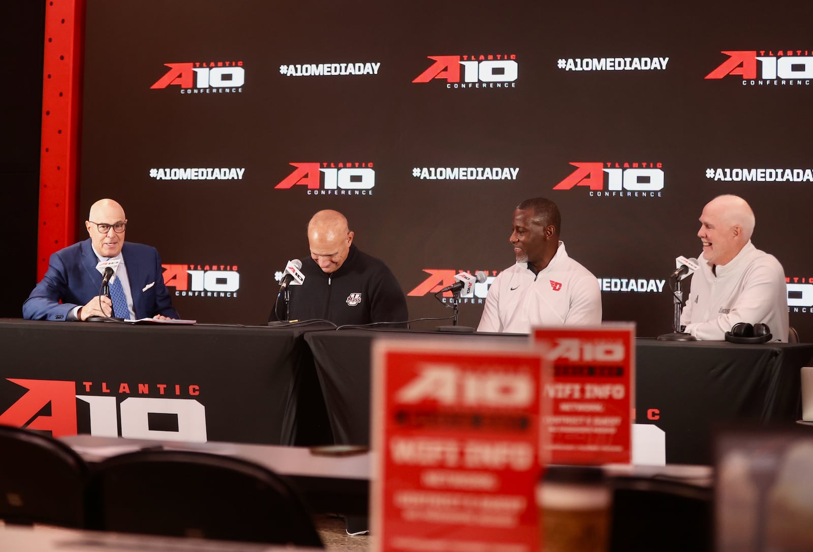 ESPN's Seth Greenberg moderates a panel discussion with Frank Martin, of Massachusetts, Dayton's Anthony Grant and St. Bonaventure's Mark Schmidt at Atlantic 10 Conference Media Day on Monday, Oct. 7, 2024, at District E next to Capital One Arena in Washington, D.C. David Jablonski/Staff