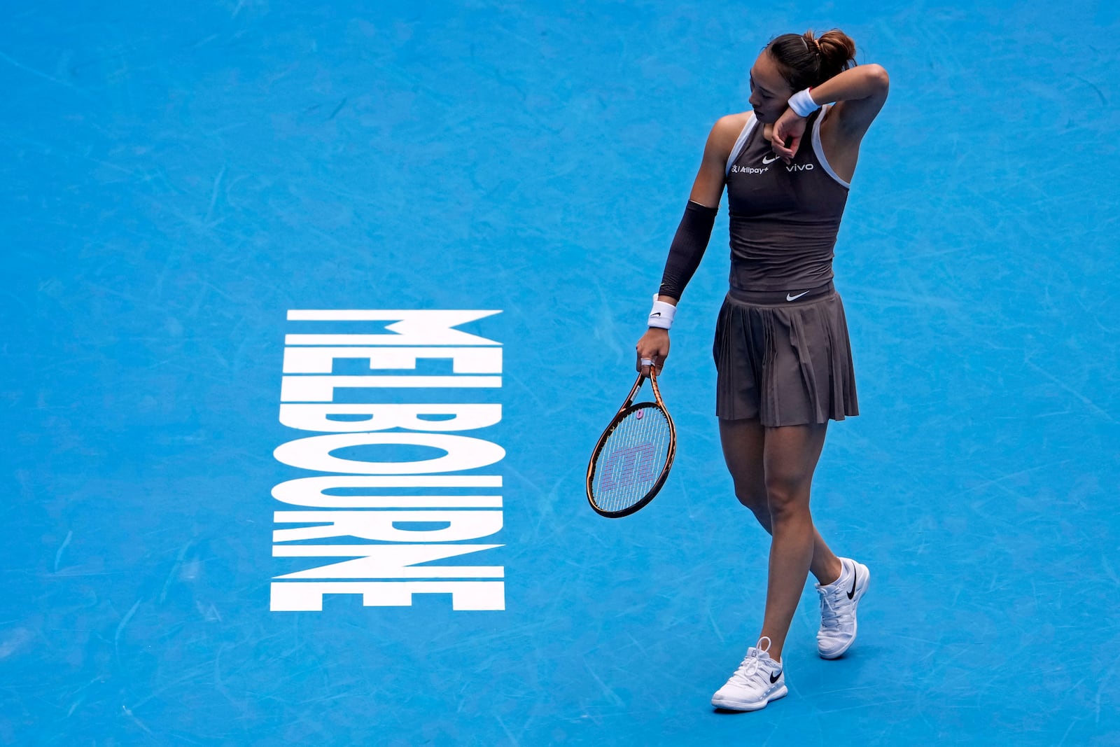 Zheng Qinwen of China reacts during her second round match against Laura Siegemund of Germany at the Australian Open tennis championship in Melbourne, Australia, Wednesday, Jan. 15, 2025. (AP Photo/Asanka Brendon Ratnayake)