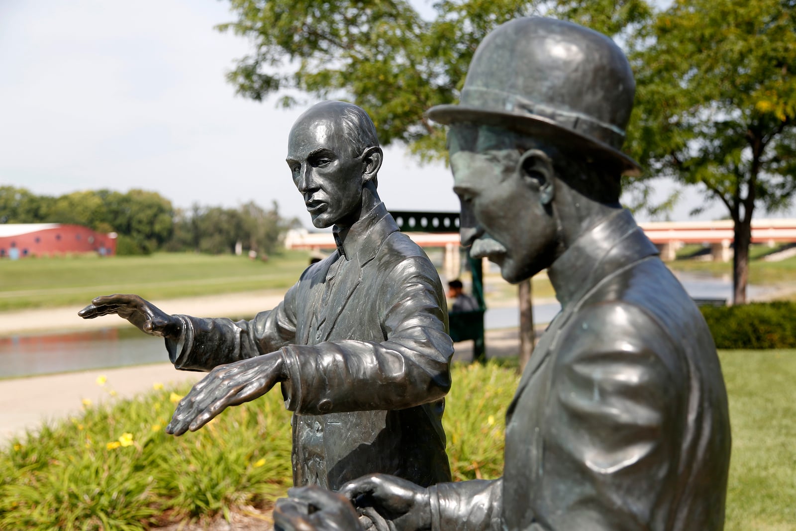 At Deeds Point, two life-sized statues of Orville and Wilbur Wright commemorate the beginnings of aircraft control. The statue captures Orville twisting a bicycle inner tube box as Wilbur explains his scheme for warping wings. LISA POWELL / STAFF