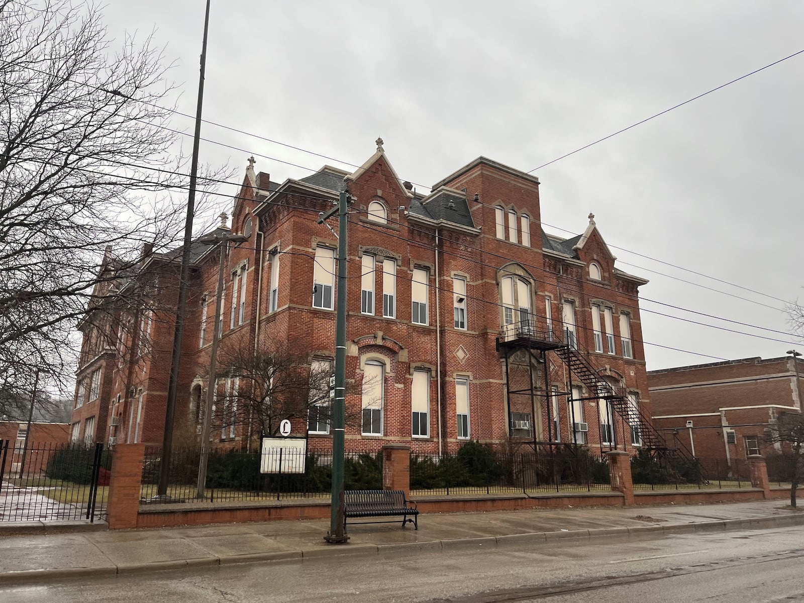 The Longfellow school campus property along Salem Avenue in northwest Dayton. Developers want to convert it into new housing and amenities like a theater and aqua farm. CORNELIUS FROLIK / STAFF