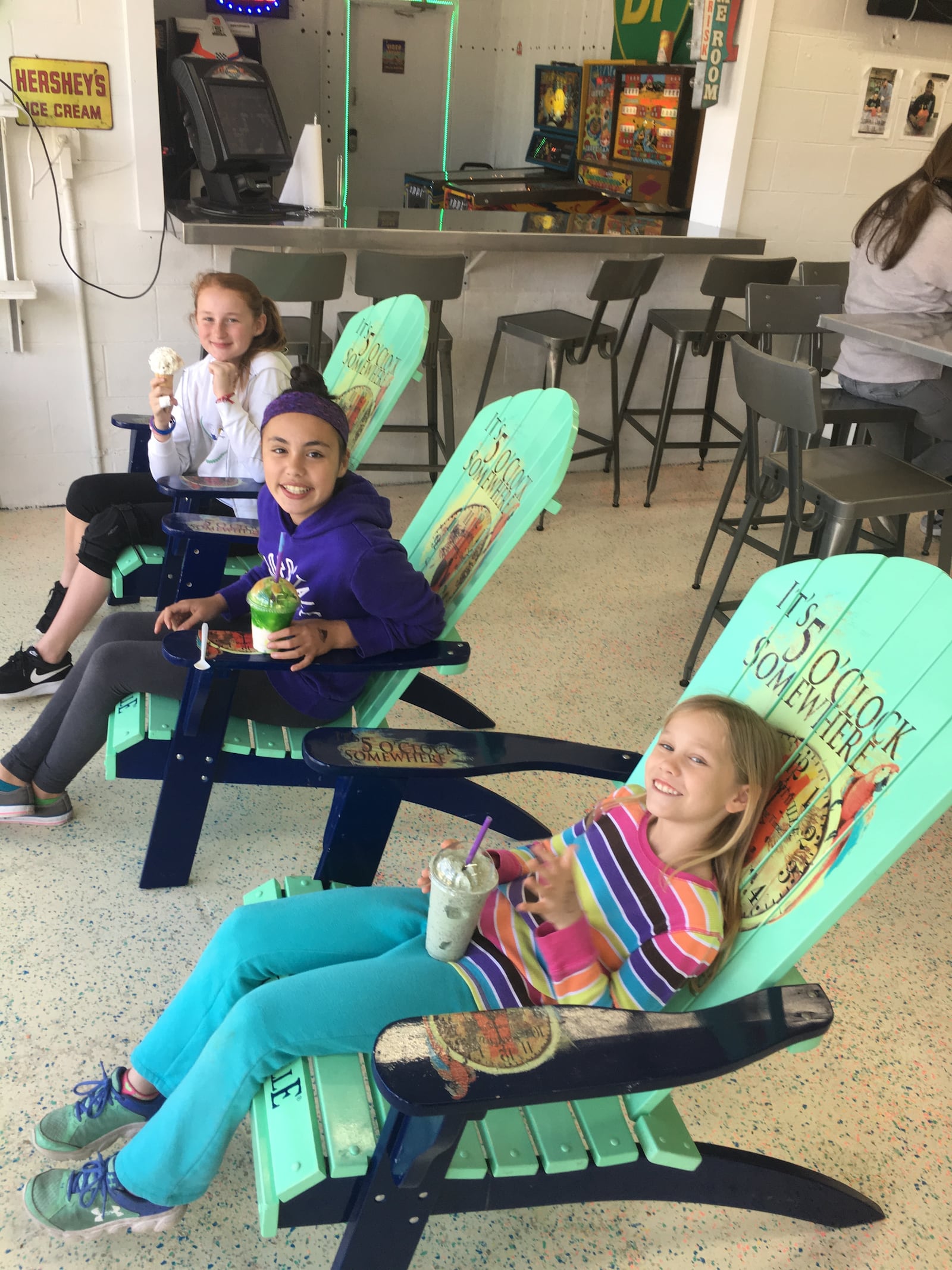 Guests at Ducky's Snowballs & Ice Cream in Troy kick back and relax and enjoy a little treat inside the shop that was converted from an old BP gas station. There is seating indoors and outdoors plus a small game room. MICHELLE FONG/STAFF