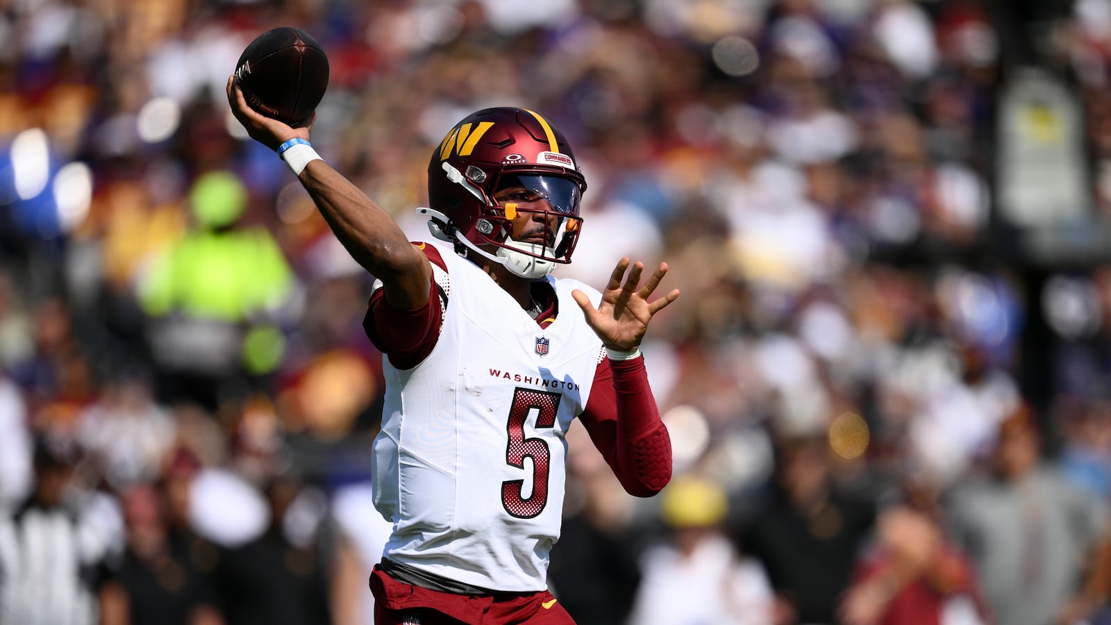 Washington Commanders quarterback Jayden Daniels throws during the first half of an NFL football game against the Baltimore Ravens Sunday, Oct. 13, 2024, in Baltimore. (AP Photo/Nick Wass)