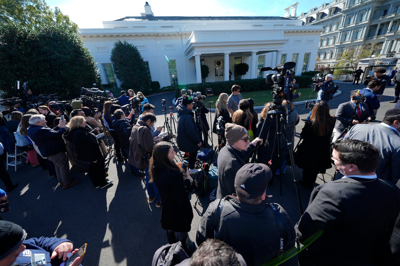 Members of the press gather outside the West Wing of the White House in Washington, Wednesday, Nov. 13, 2024, before President Joe Biden meets with President-elect Donald Trump in the Oval Office. (AP Photo/Susan Walsh)