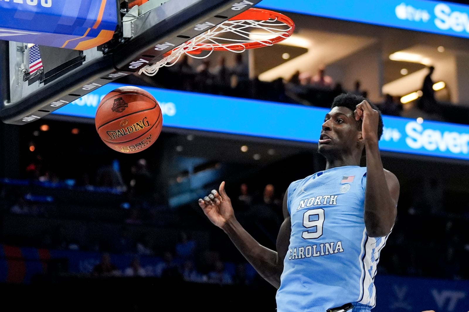 North Carolina guard Drake Powell dunks against Duke during the first half of an NCAA college basketball game in the semifinals of the Atlantic Coast Conference tournament, Friday, March 14, 2025, in Charlotte, N.C. (AP Photo/Chris Carlson)