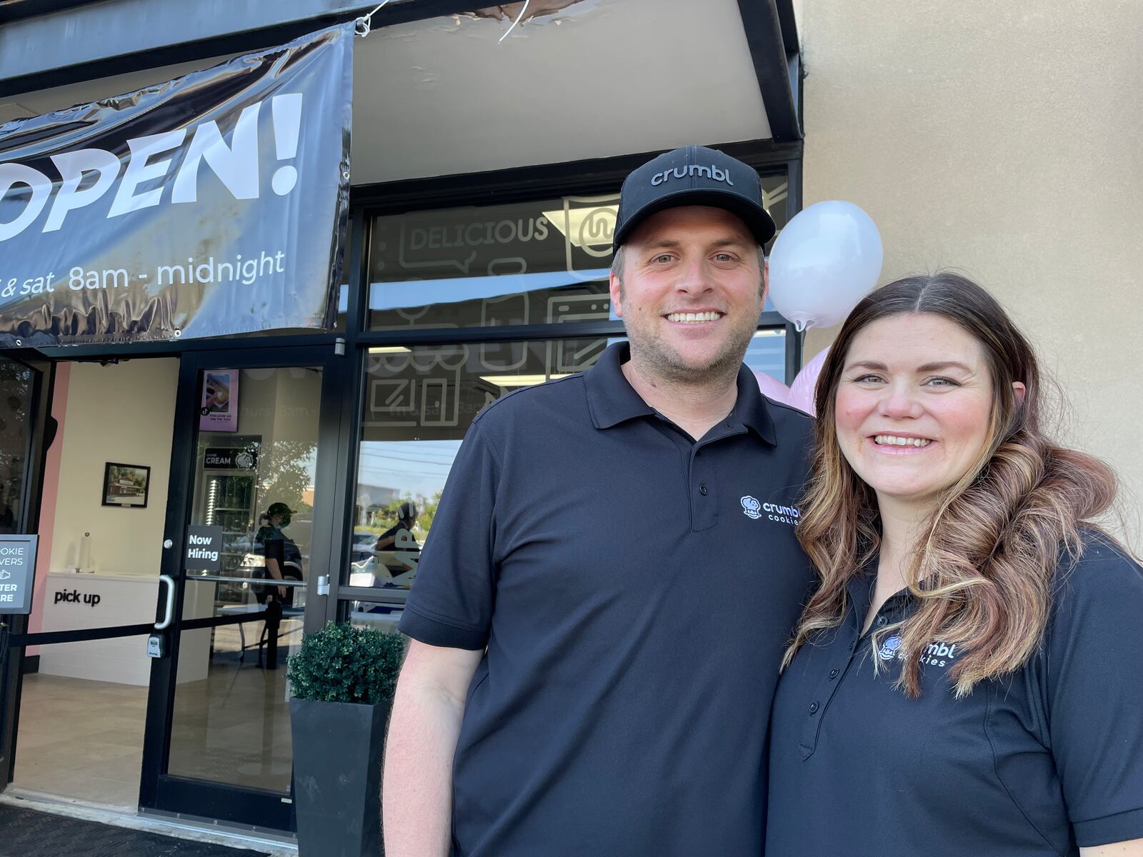 The Dayton region’s fourth Crumbl Cookies is opening its doors on Friday, Jan. 12 at 4457 Feedwire Road in between Donato’s Pizza and Sleep Outfitters in Centerville. Pictured is franchise owners Eric and Kendra Stringham. NATALIE JONES/STAFF