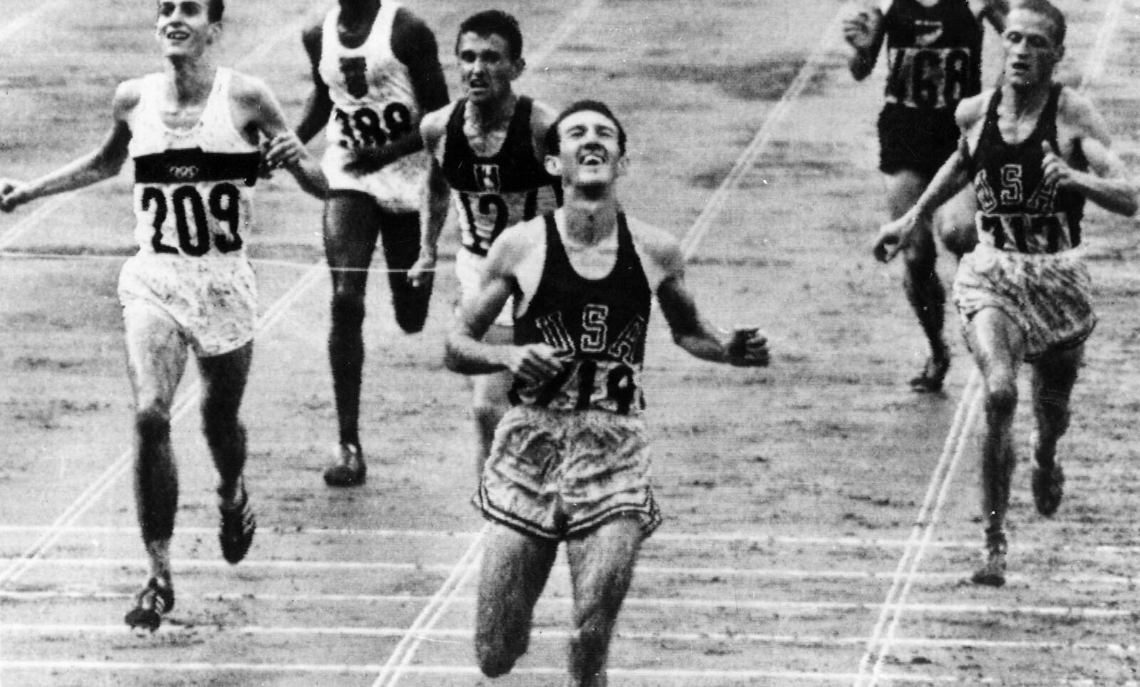 Bob Schul crossed the finish line to become the first American and only American to win the 5,000 meters in the Olympics at the Tokyo Games on Oct. 18, 1964. Photo courtesy of USOC archives.