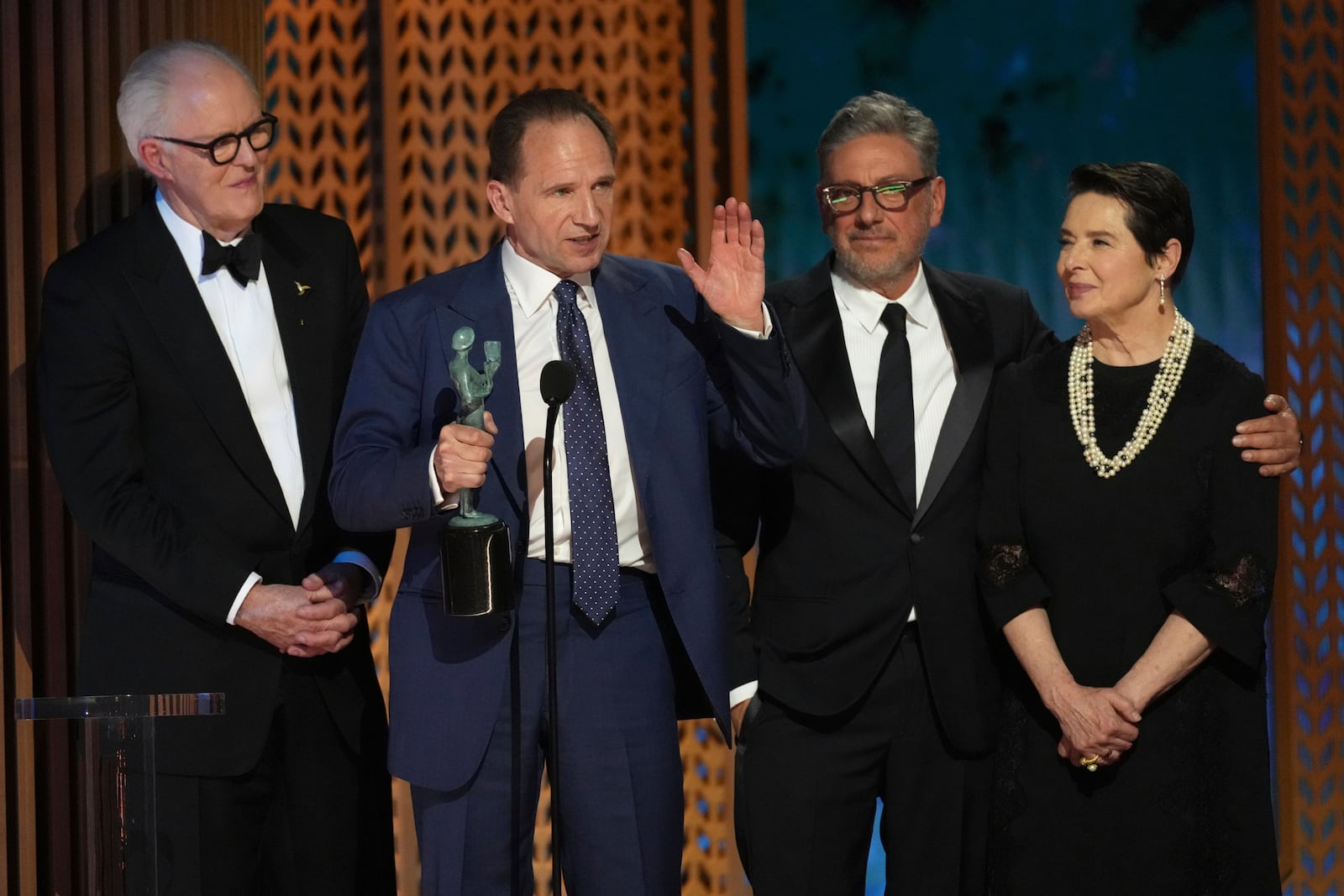 John Lithgow, from left, Ralph Fiennes, Sergio Castellitto, and Isabella Rossellini accepts the award for outstanding performance by a cast in a motion picture for "Conclave" during the 31st annual Screen Actors Guild Awards on Sunday, Feb. 23, 2025, at the Shrine Auditorium in Los Angeles. (AP Photo/Chris Pizzello)