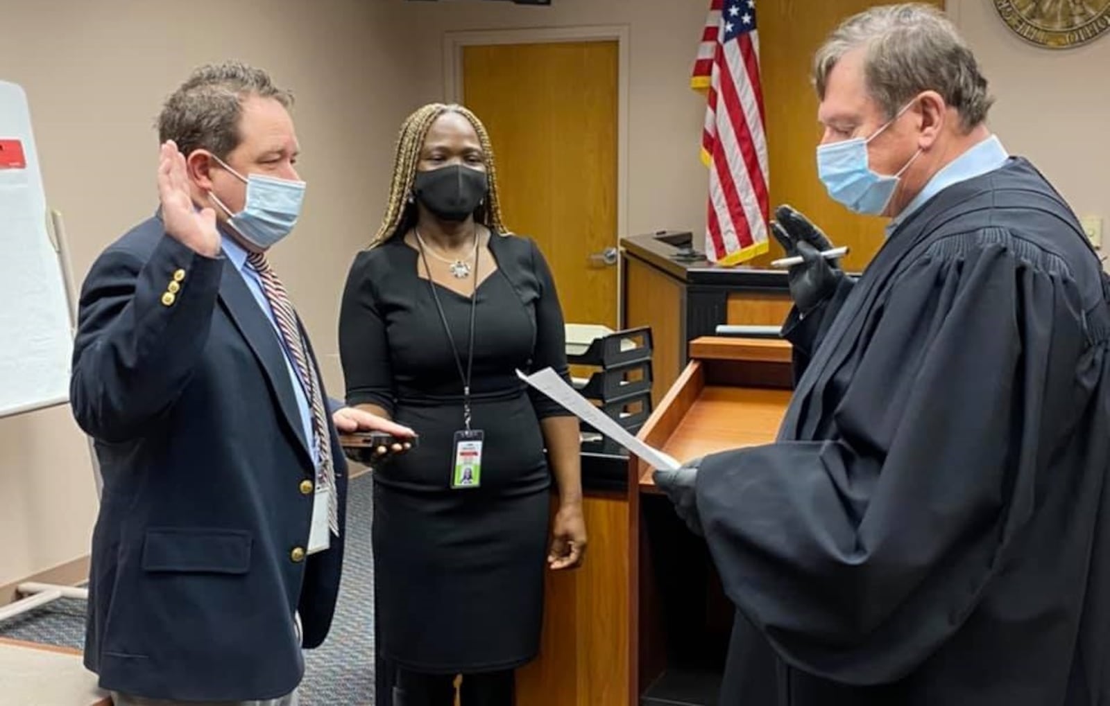 Montgomery County Municipal Court Judge James Piergies, right, swears in Montgomery County Clerk of Courts Mike Foley, left, Dec. 22, 2020, for his new term 2021-24. Contributed