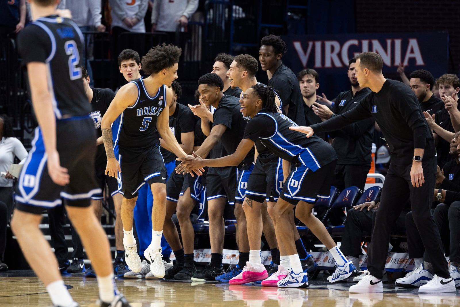 Duke guard Tyrese Proctor (5) celebrates with guard Isaiah Evans during the second half of an NCAA college basketball game against Virginia, Monday, Feb. 17, 2025, in Charlottesville, Va. (AP Photo/Mike Kropf)