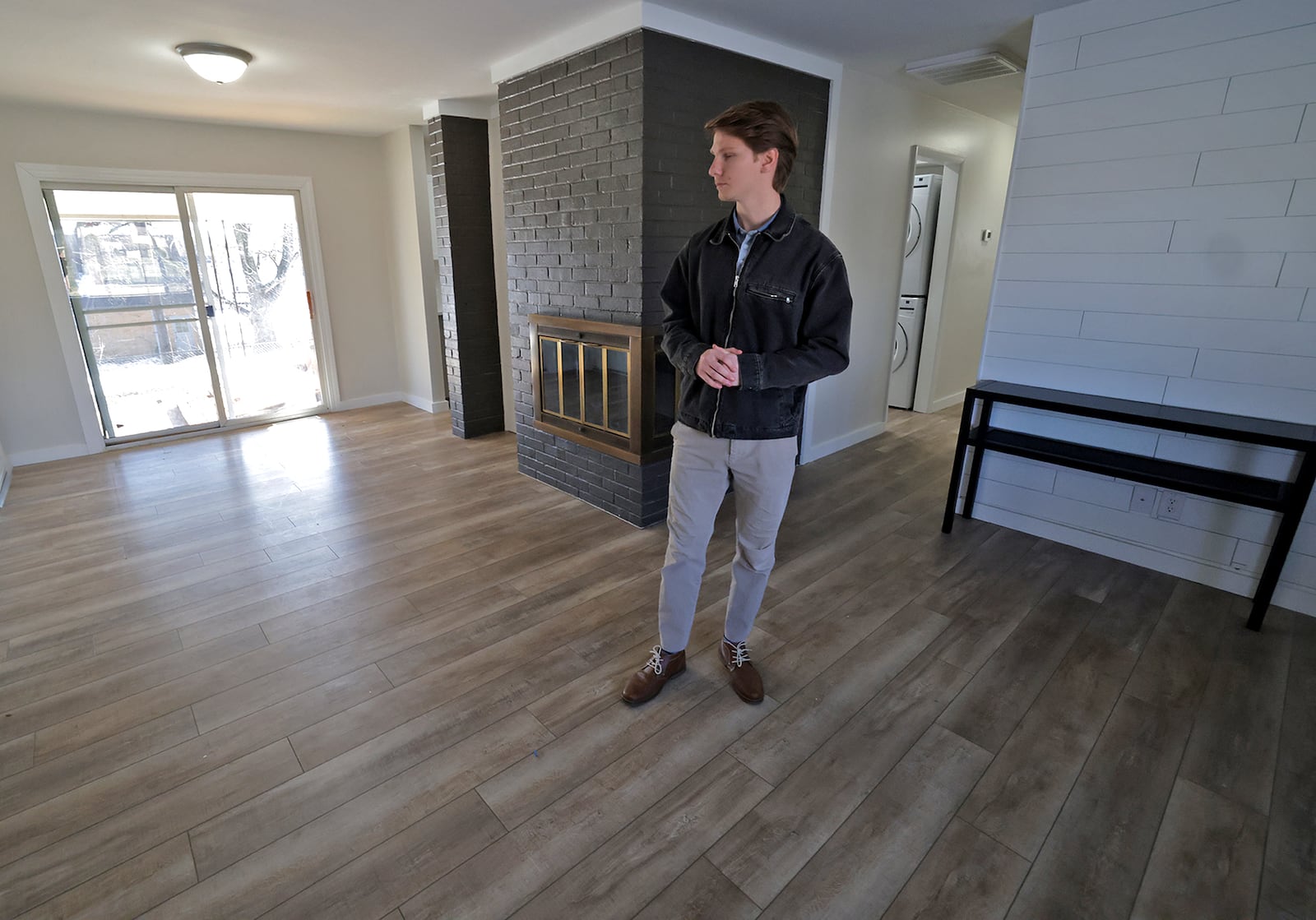 Andrew Good looks around his new house Wednesday, Jan. 29, 2025 as he plans how he will position his furniture after he closes on the property this week. BILL LACKEY/STAFF