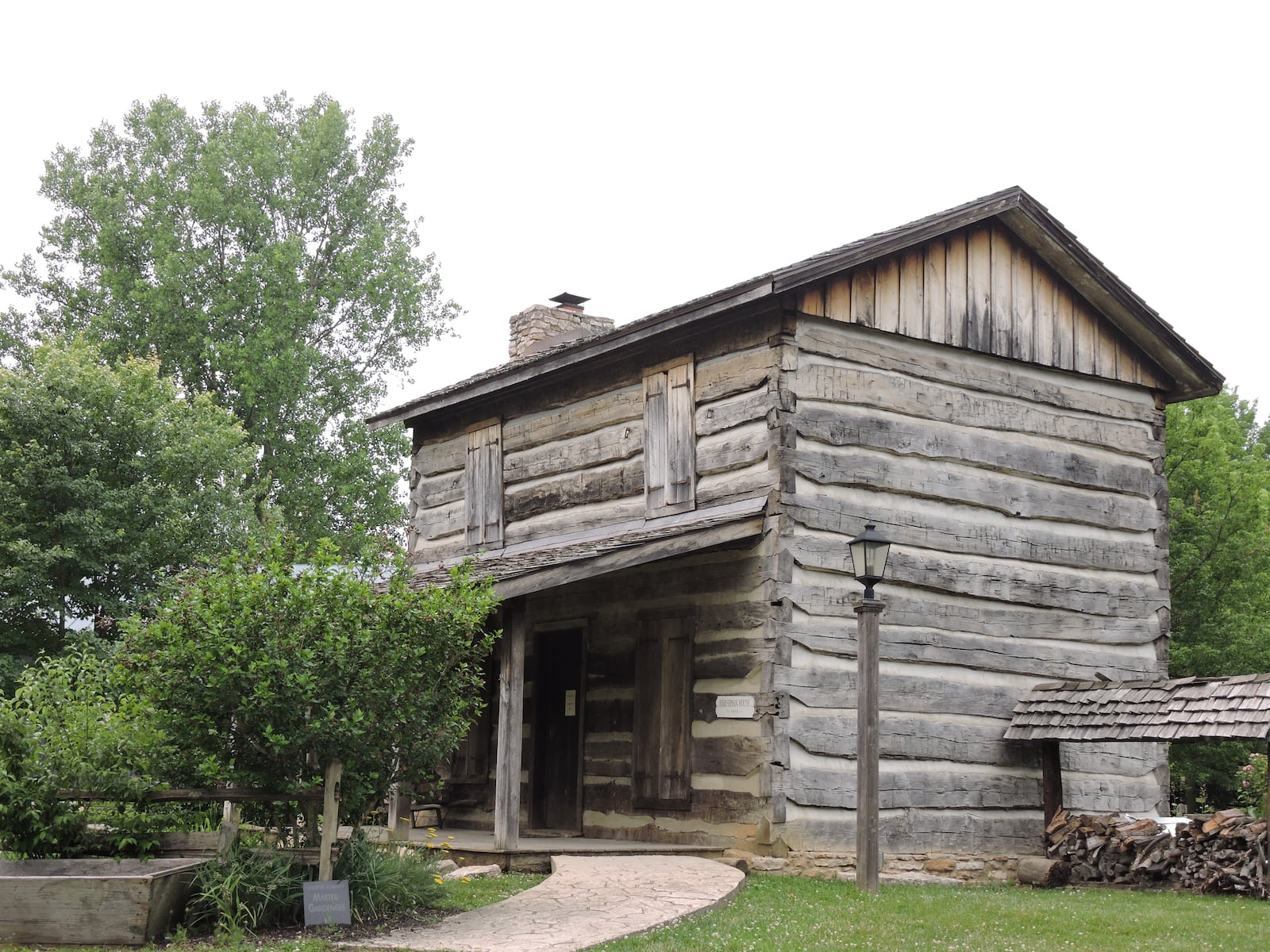 The Philip Harshman house, circa 1803-07, located within Beavercreek's historical Wartinger Park on Kemp Road. DIANA BLOWERS/CONTRIBUTED