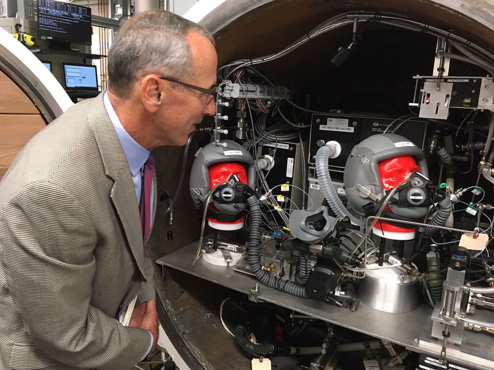 National Commission on Military Aviation Safety Commissioner retired Air Force Gen. Raymond E. Johns looks over testing equipment at the 711th Human Performance Wing’s On-board Oxygen Generation Systems Laboratory Sept. 11, 2019, during the commission’s visit to Wright-Patterson Air Force Base. NATIONAL COMMISSION ON MILITARY AVIATION SAFETY PHOTO/BRYAN WHITMAN