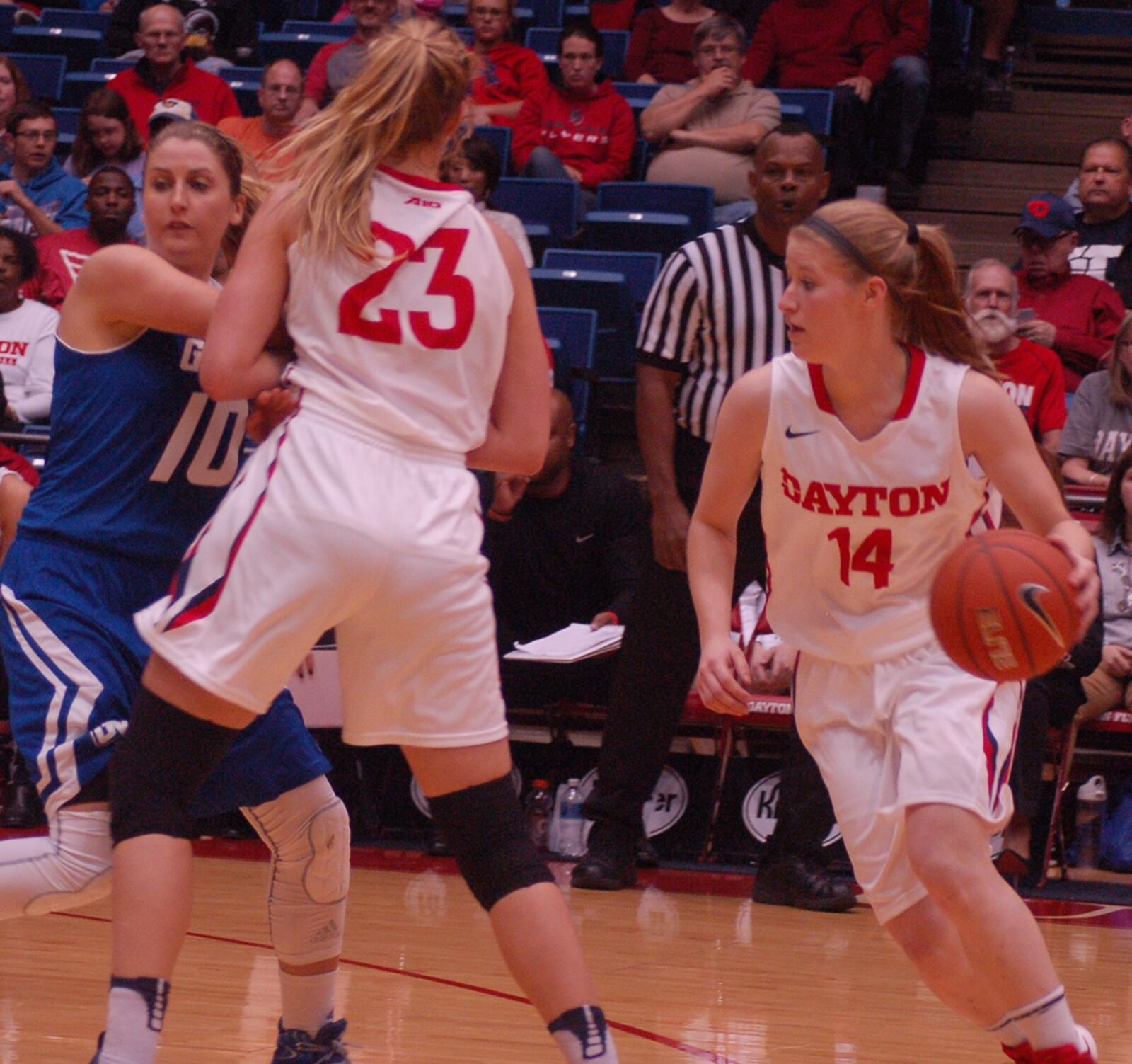 Jenna Burdette cuts off a screen by Maddy Dennis during the Flyers’ preseason 74-48 win over Grand Valley State Sunday at UD Arena. JOHN CUMMINGS / STAFF