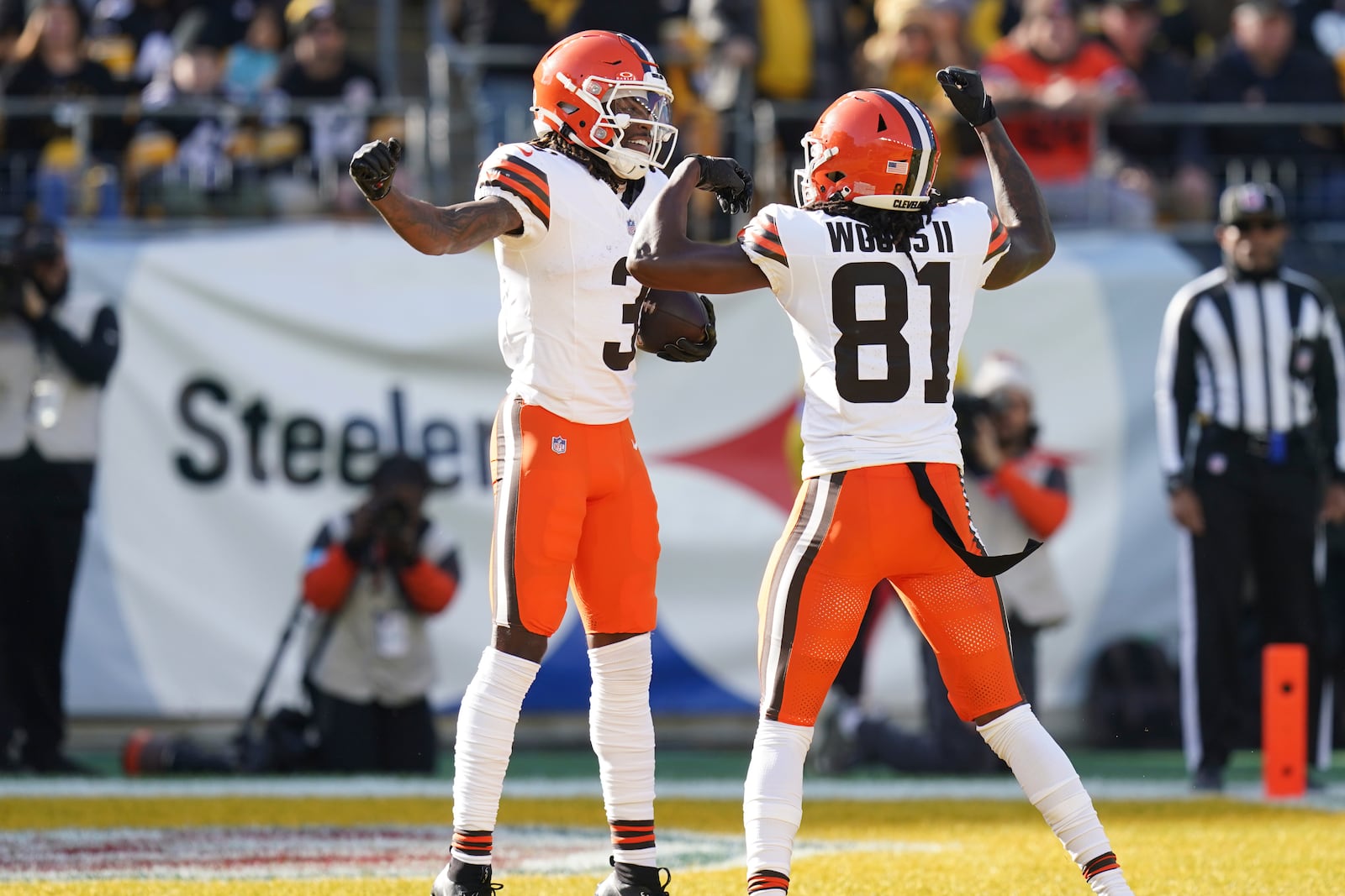 Cleveland Browns wide receiver Jerry Jeudy (3) celebrates with teammate Michael Woods II (81) after scoring a touchdown in the first half of an NFL football game against the Pittsburgh Steelers in Pittsburgh, Sunday, Dec. 8, 2024. (AP Photo/Matt Freed)