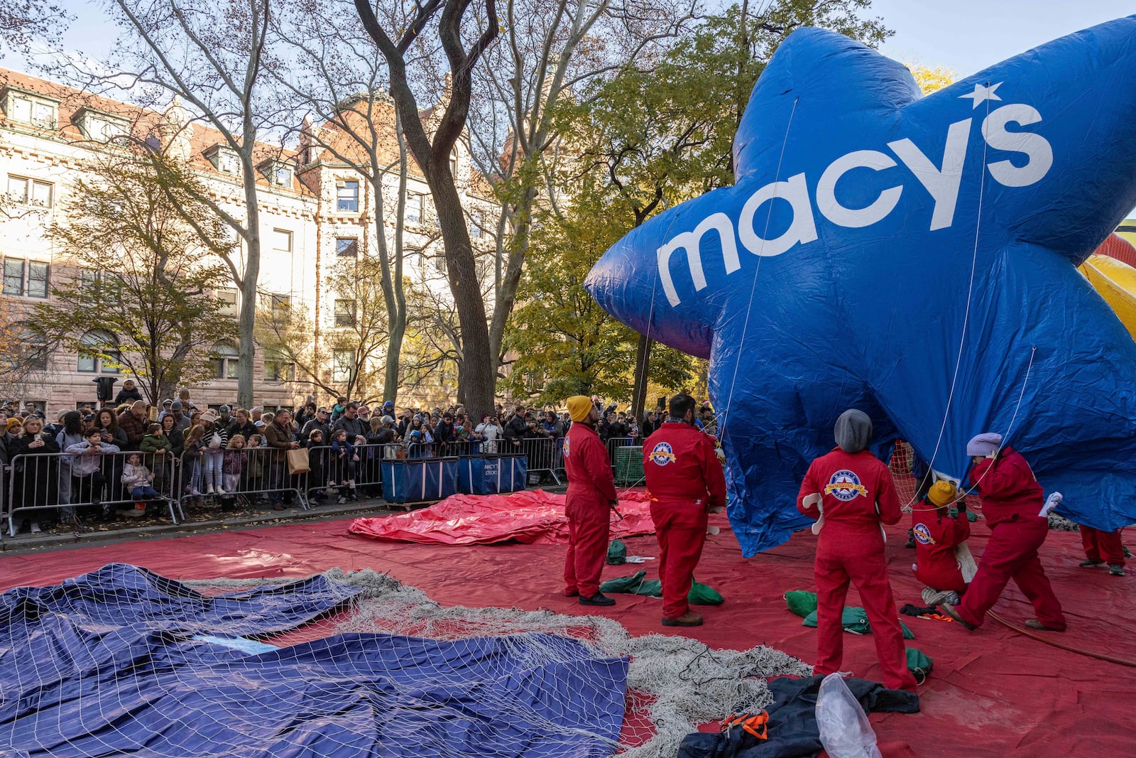 People inflate a float of Macy's Stars in preparation for the Macy's Thanksgiving Day Parade, Wednesday, Nov. 27, 2024, in New York. (AP Photo/Yuki Iwamura)