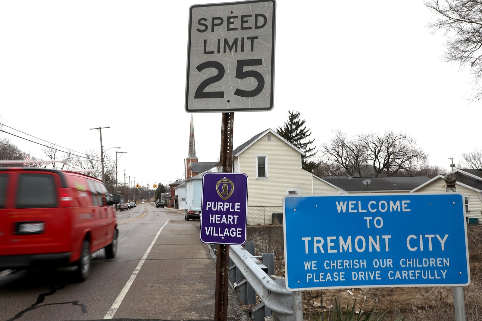 A sign welcomes motorists to Tremont City next to a 25 mph speed limit sign Tuesday, March 20, 2018. Bill Lackey/Staff