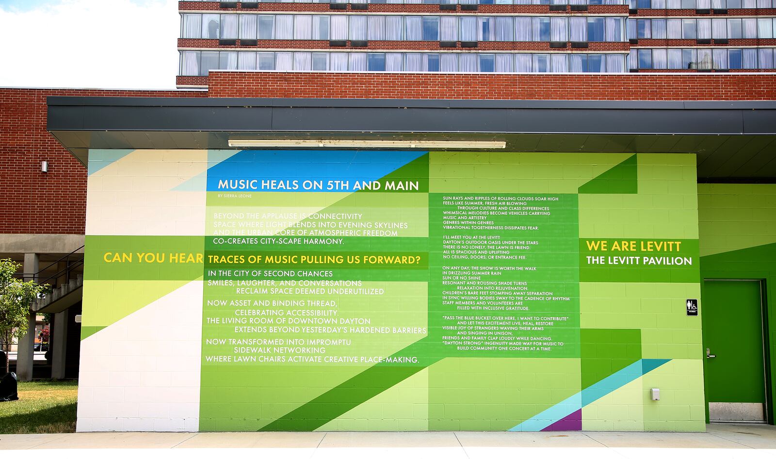 MixedA new mural, with poetry written by Sierra Leone,  has been completed at the Levitt Pavilion in Dayton. The poem, “Music Heals on Fifth and Main,” can be read in full on the north side of the building located east of the pavilion. The mural, a combination of bold shapes and bright colors, was designed by Brent Beck and executed by Atalie Gagnet, two local artists.   LISA POWELL / STAFF