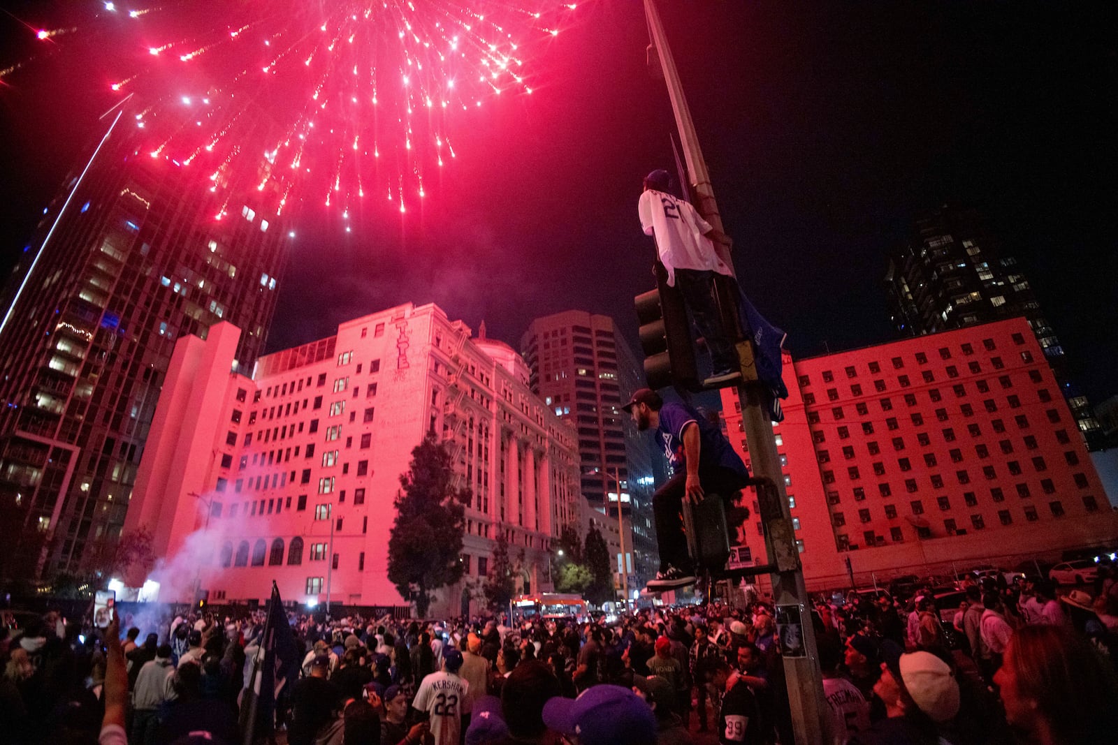 Fireworks go off as fans celebrate on the streets after the Los Angeles Dodgers won against the New York Yankees in the baseball World Series Wednesday, Oct. 30, 2024, in Los Angeles. (AP Photo/Ethan Swope)