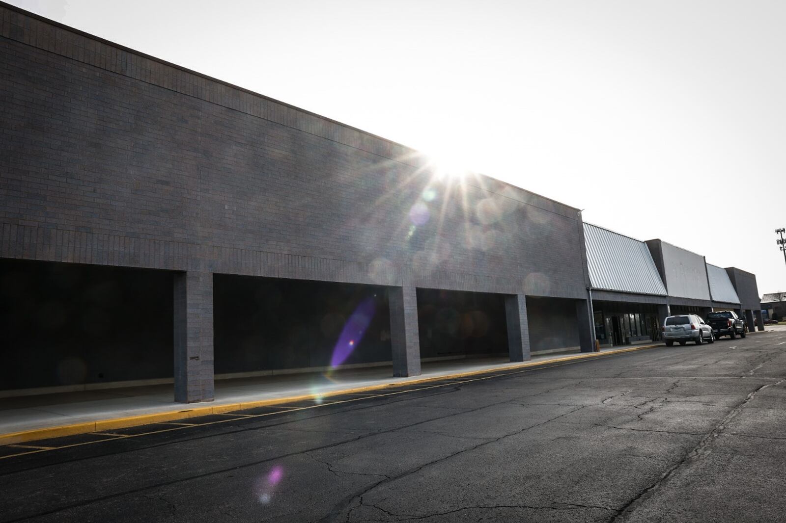 The former Marc's and Kroger grocery stores on Whipp Road in Kettering is being turned into a trampoline park. Workers are on the inside rehabbing the former store. JIM NOELKER/STAFF