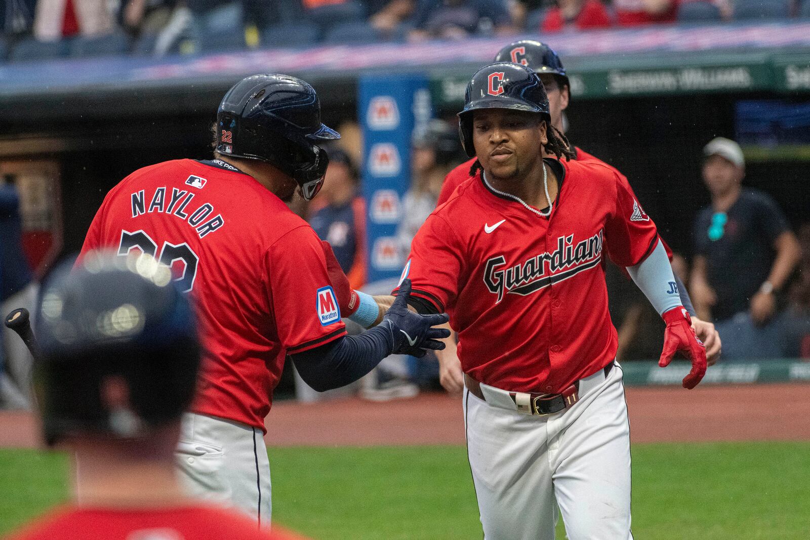 Cleveland Guardians' Josh Naylor, left, greets Jose Ramirez, right, after Ramirez hit a two-run home run off Houston Astros starting pitcher Justin Verlander during the first inning of a baseball game in Cleveland, Saturday, Sept. 28, 2024. (AP Photo/Phil Long)