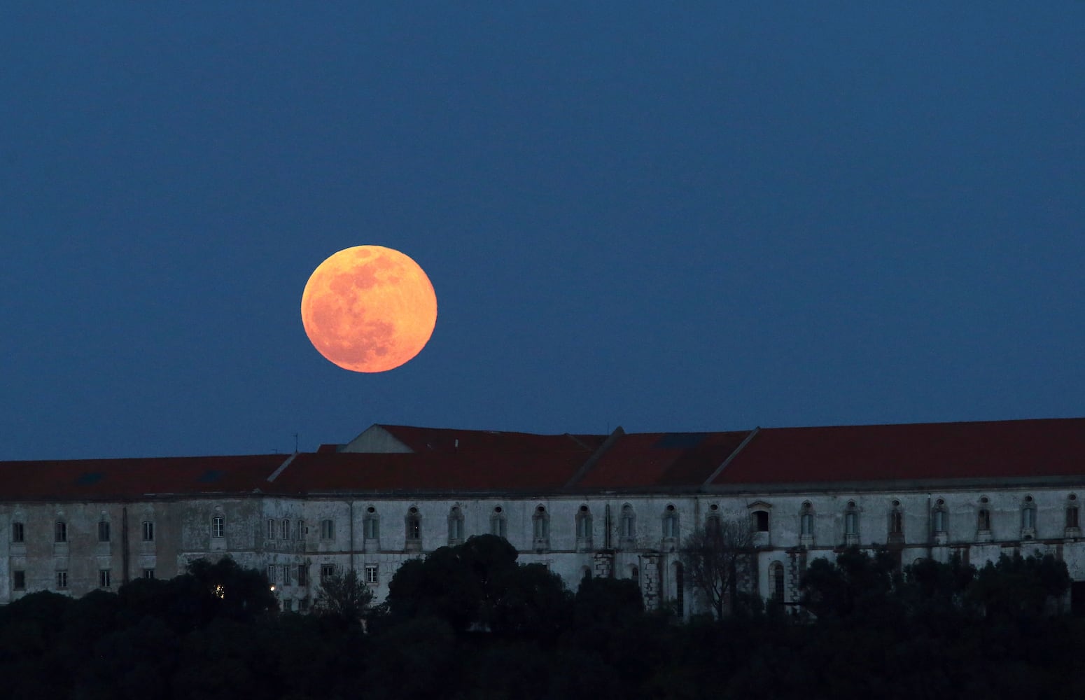 Photos: 'Super snow moon,' largest supermoon of 2019, lights up the sky