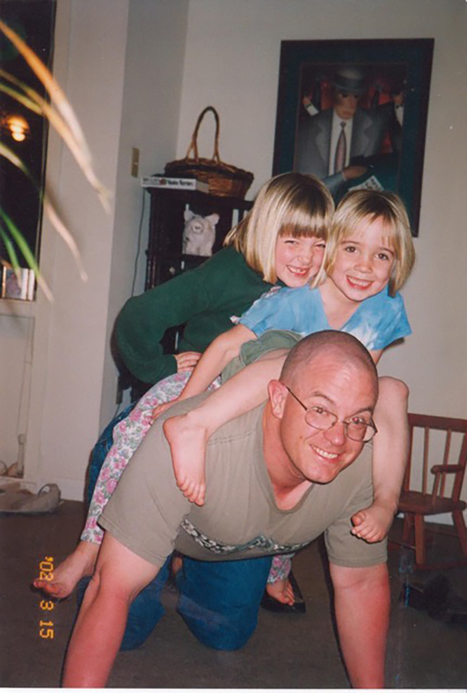 Dan Semsel with his two young daughters after he was diagnosed with thyroid cancer in 2001 - Natalie, top left, and Olivia. CONTRIBUTED