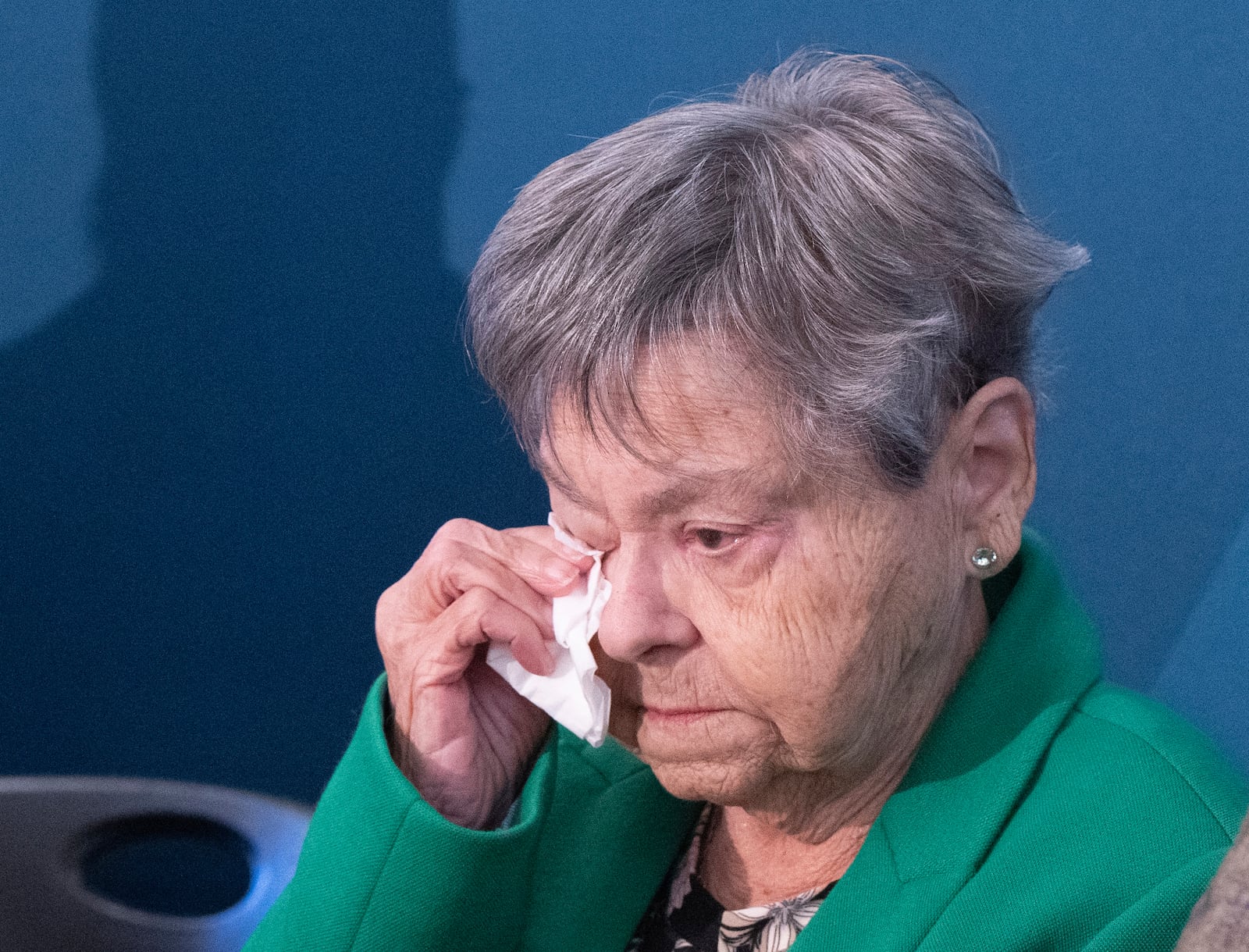 Lise Blais, widow of plaintiff Jean-Yves Blais, wipes her eye during a news conference in Montreal, on Friday, Oct. 18, 2024. Tobacco companies have offered to pay nearly $24 billion USD in compensation to smokers and their loved ones. (Ryan Remiorz/The Canadian Press via AP)