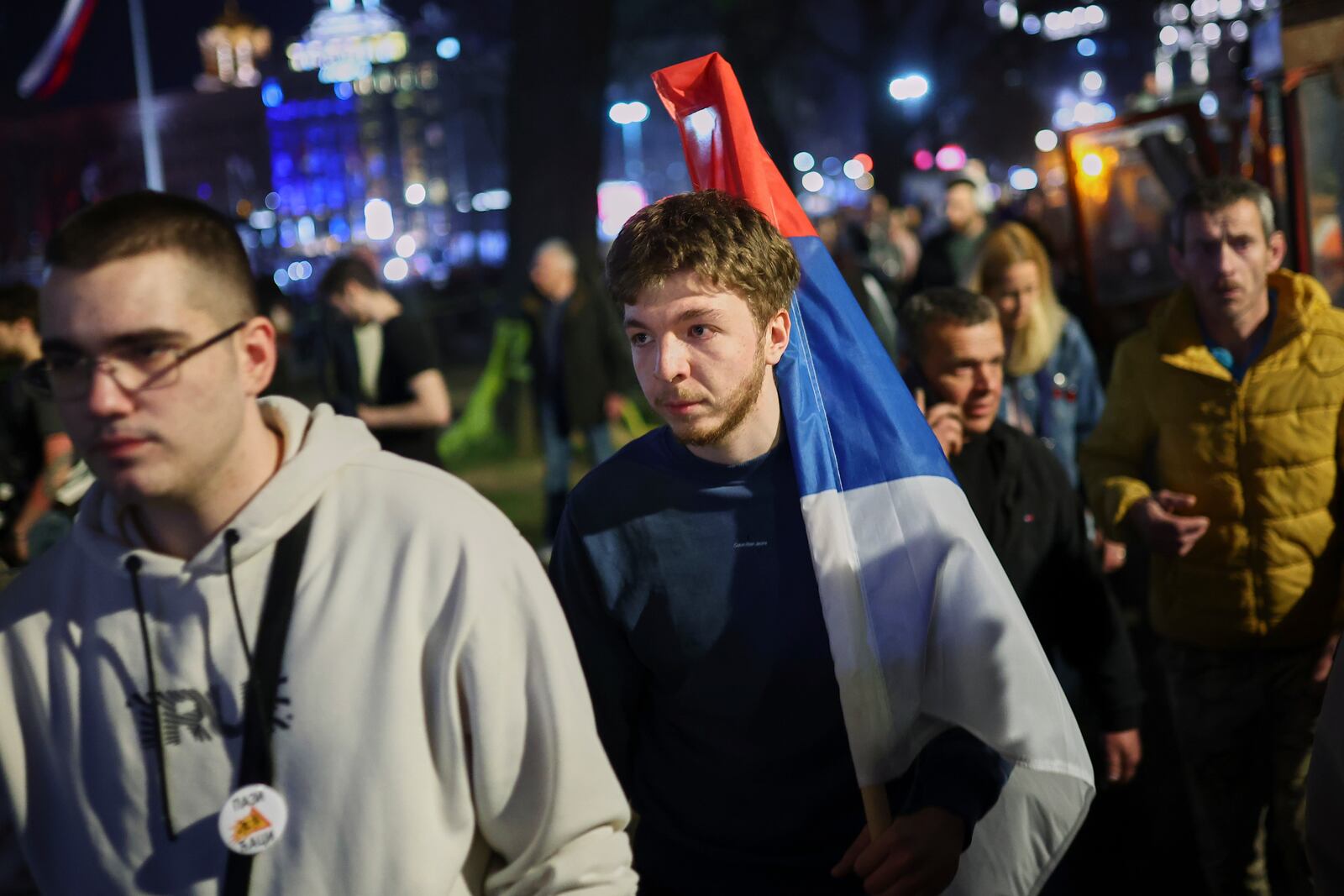 People gather ahead of a major rally this weekend in downtown Belgrade, Serbia, Friday, March 14, 2025. (AP Photo/Armin Durgut)