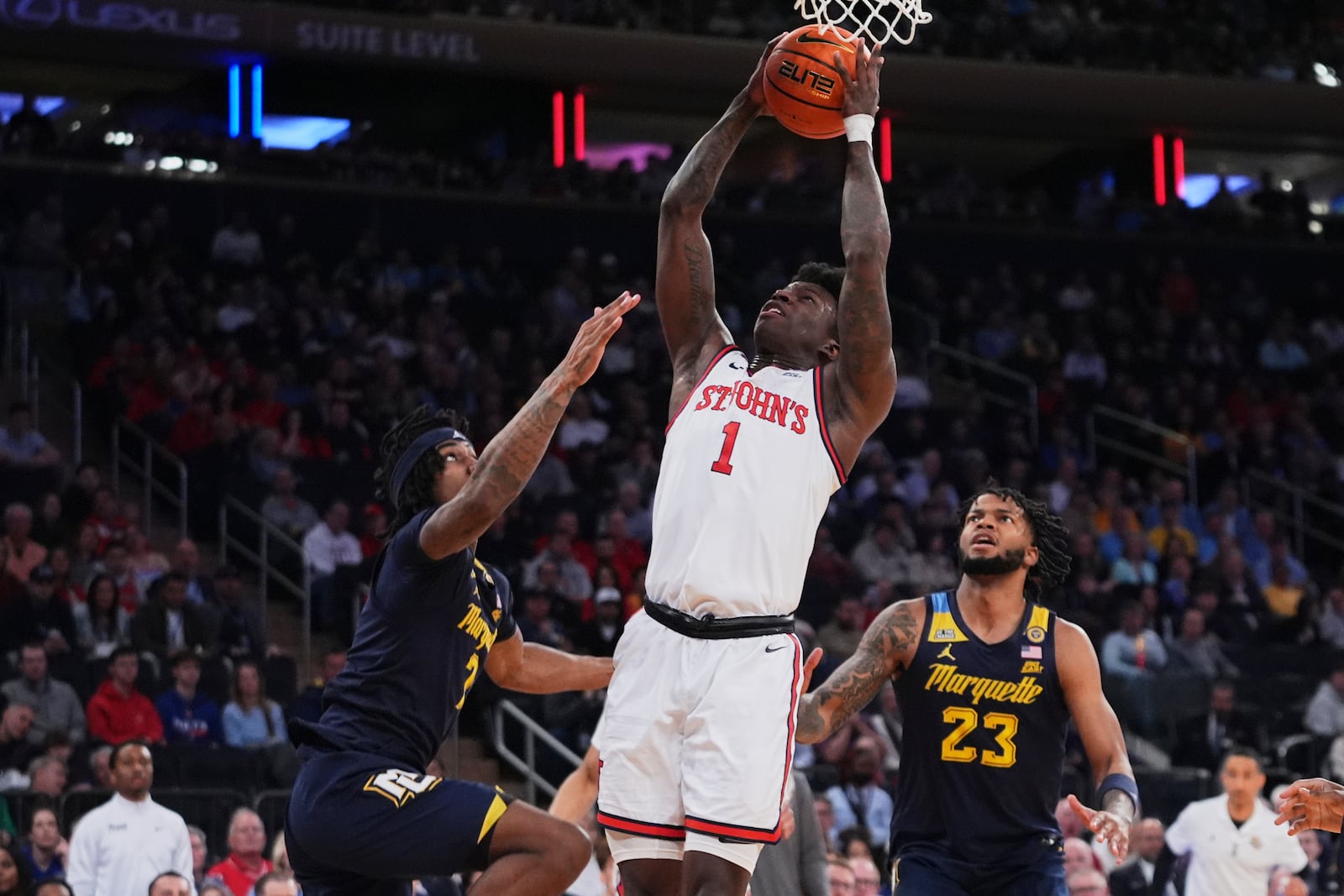 St. John's's Kadary Richmond (1) shoots over Marquette's Chase Ross (2) and David Joplin (23) during the first half of an NCAA college basketball game in the semifinals of the Big East tournament Friday, March 14, 2025, in New York. (AP Photo/Frank Franklin II)